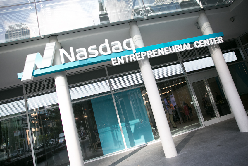 Nasdaq Entrepreneurial Center building in gray, white, and green.