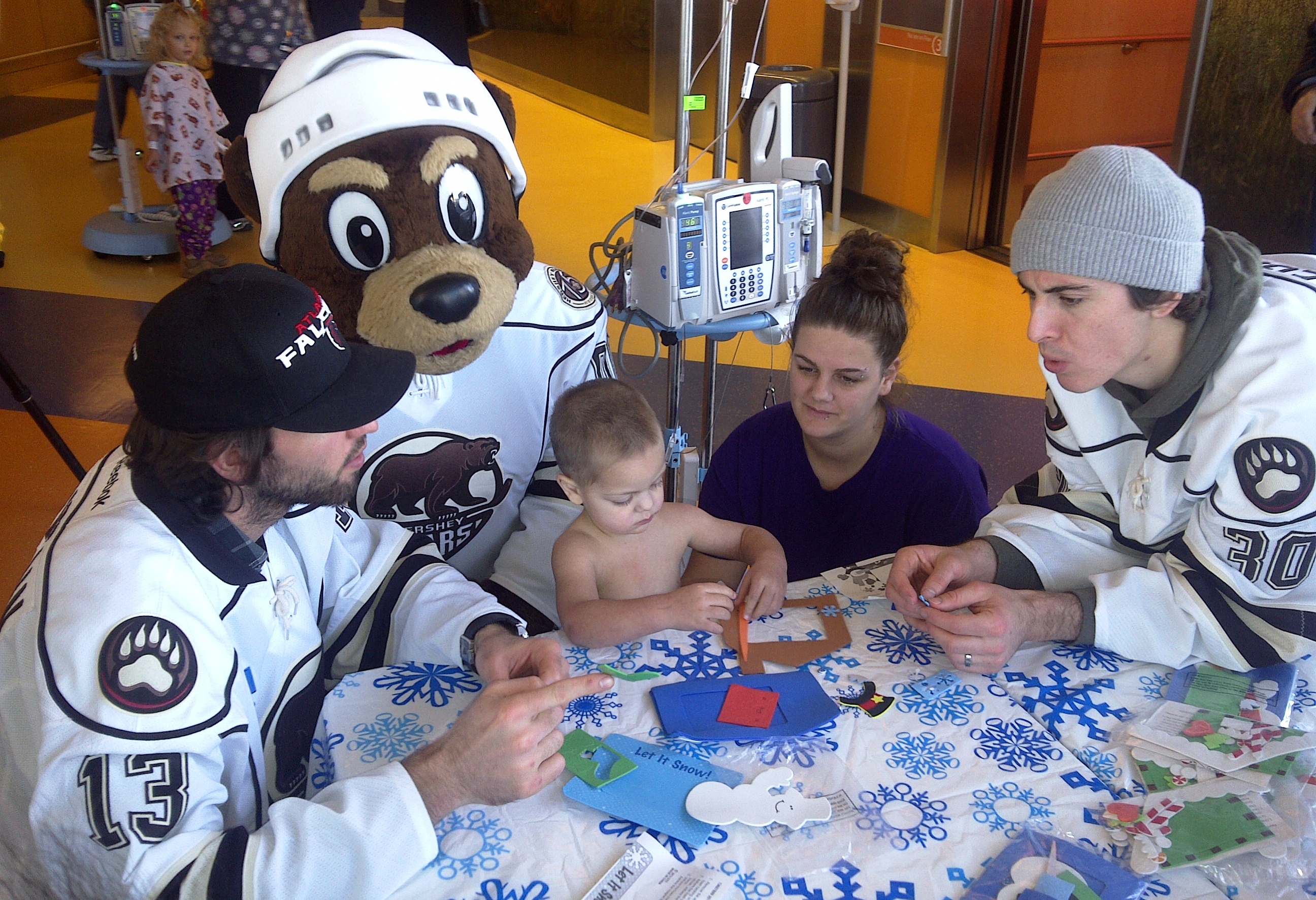 Players visit with children