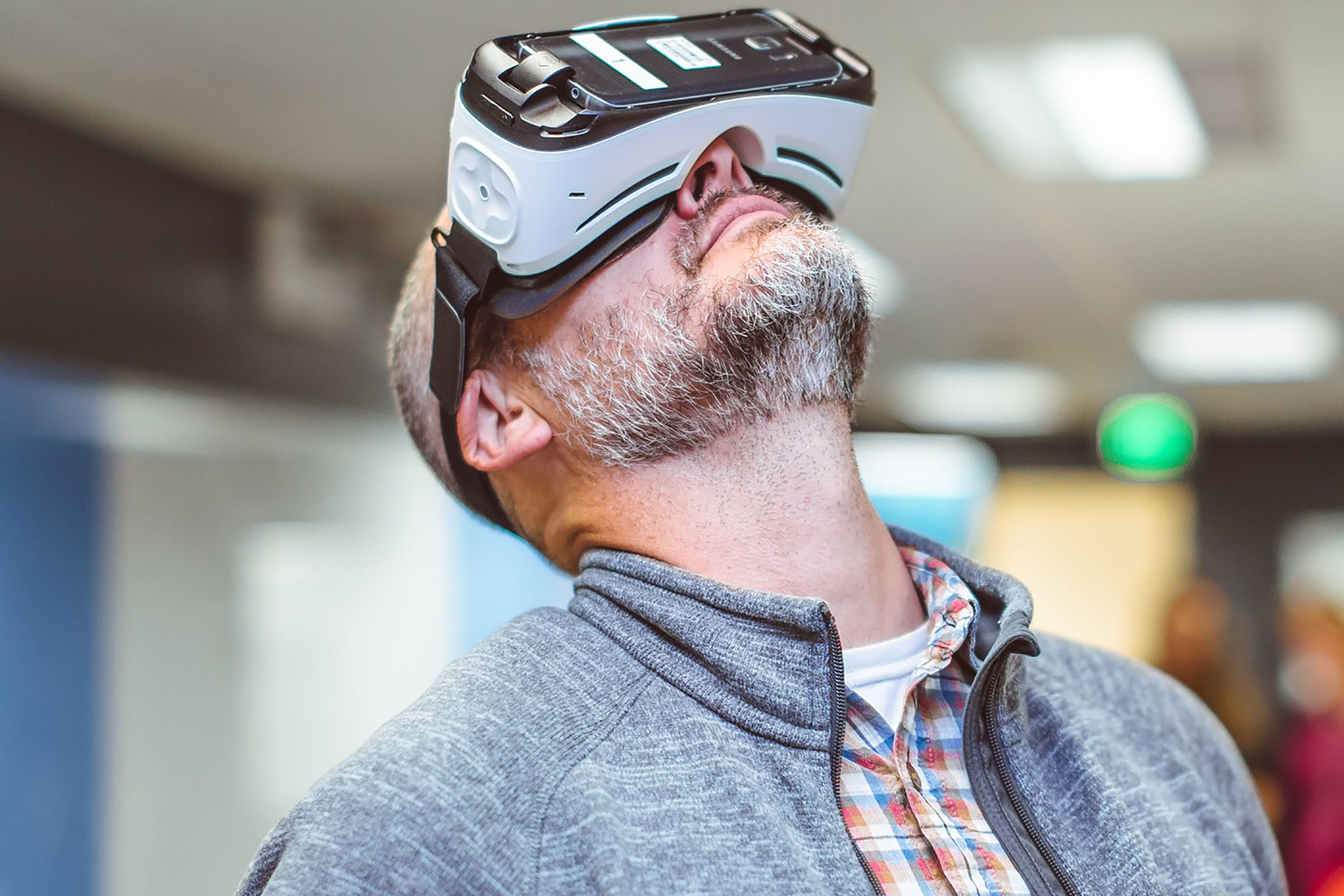 man looking up while wearing a 360-degree video headset