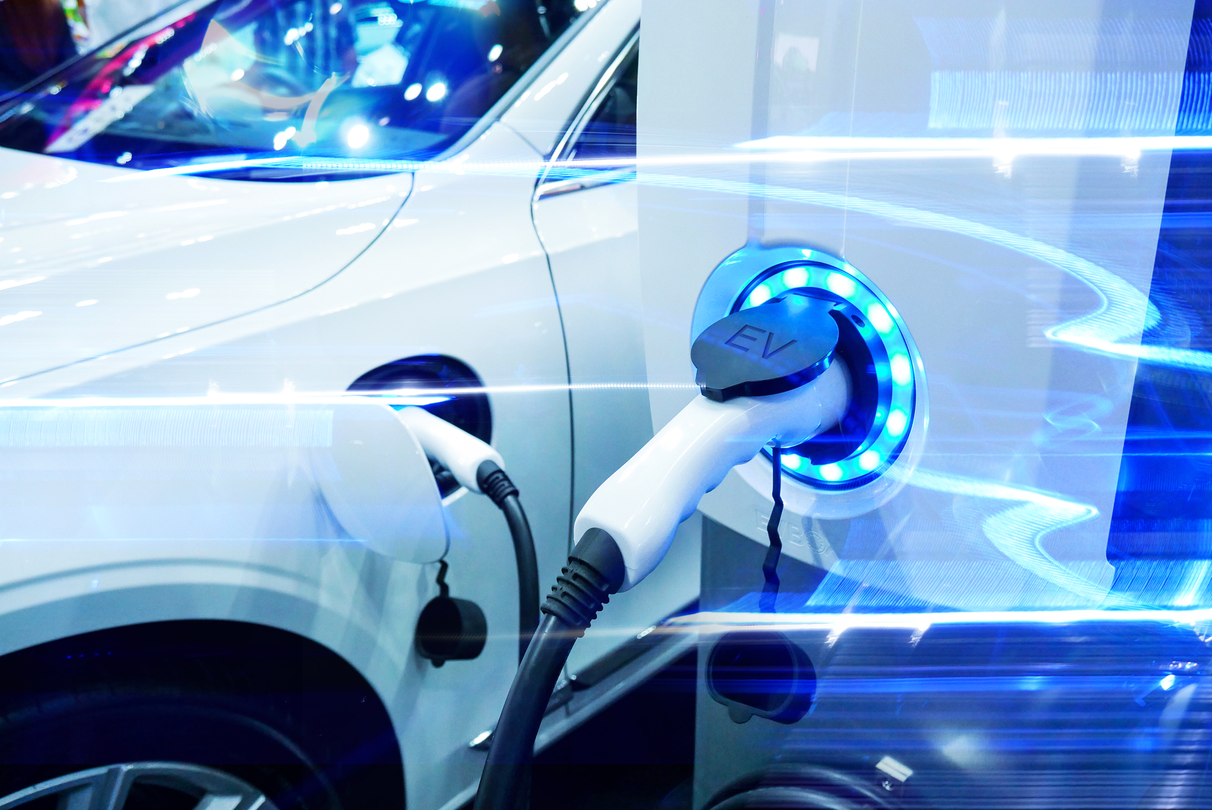 A stock image of an electric vehicle being charged.