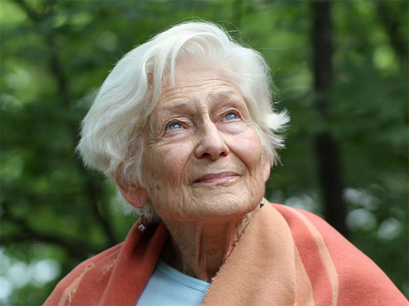 Irene Butter, a smiling woman with gray hair and blue eyes.