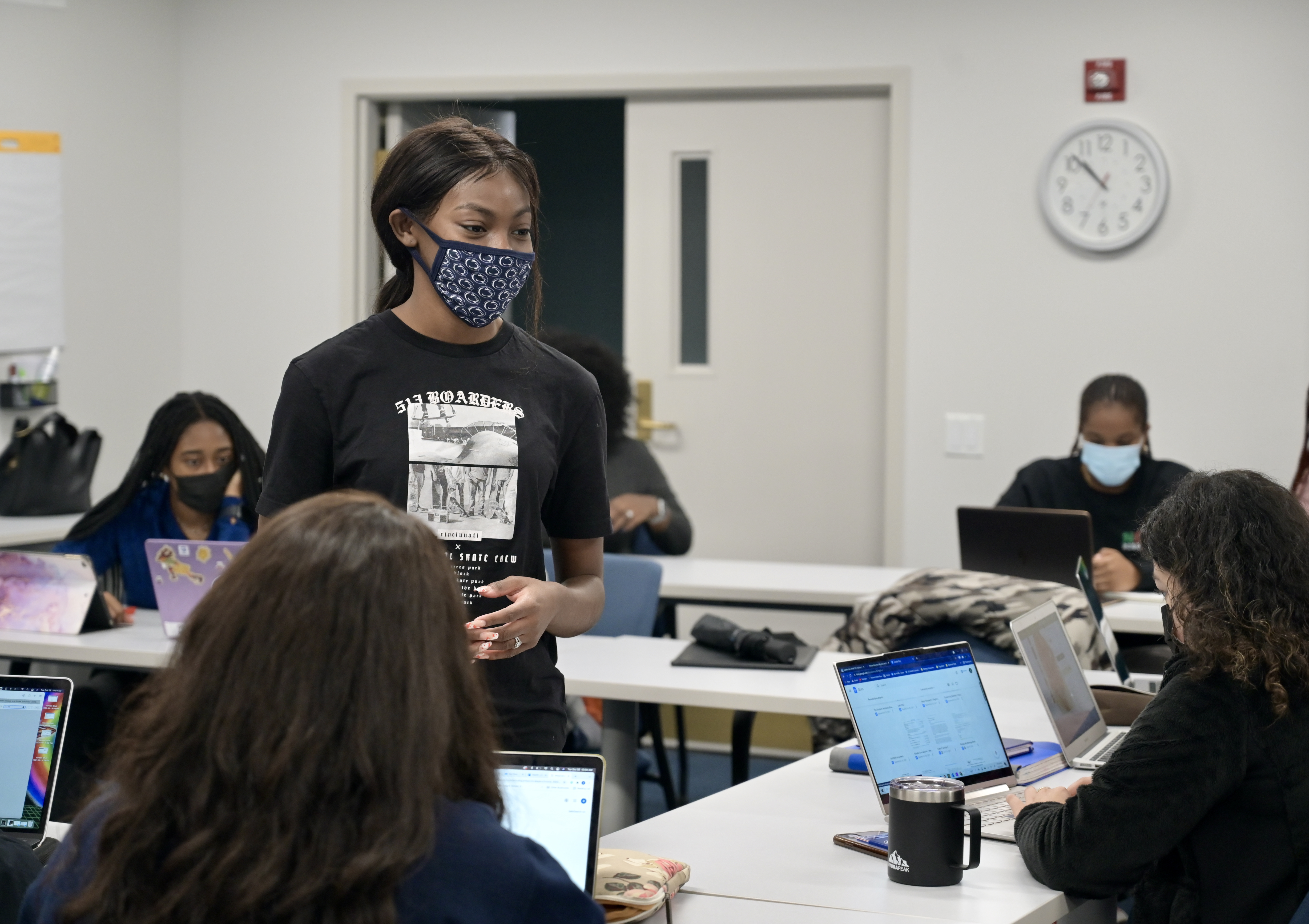 Janiyah Davis stands in front of a class of students