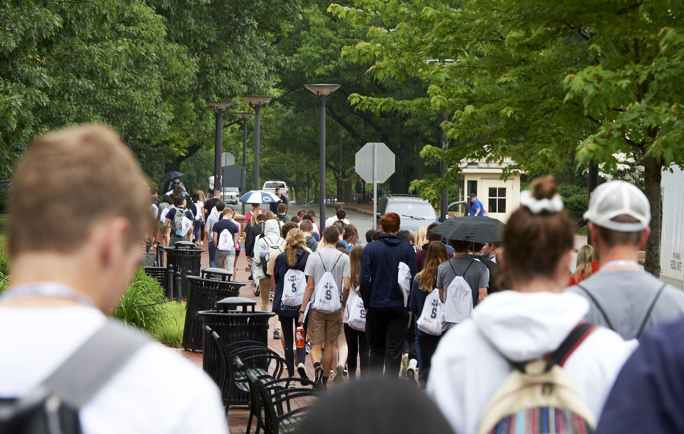 Students walking down a sidewalk during New Student Orientation