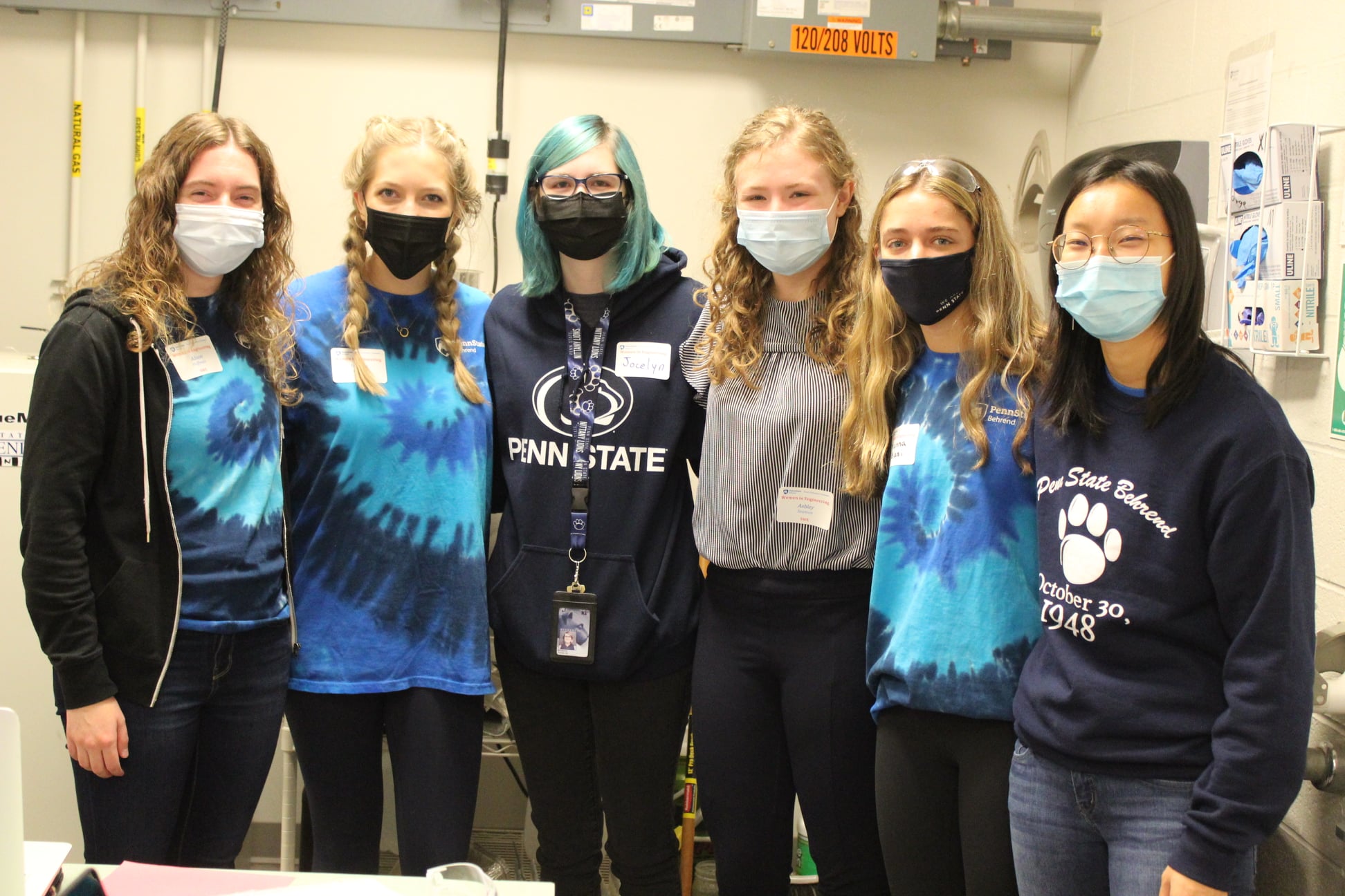 Six female student volunteers pose for a group photo during Penn State Behrend's Women in Engineering Day program.