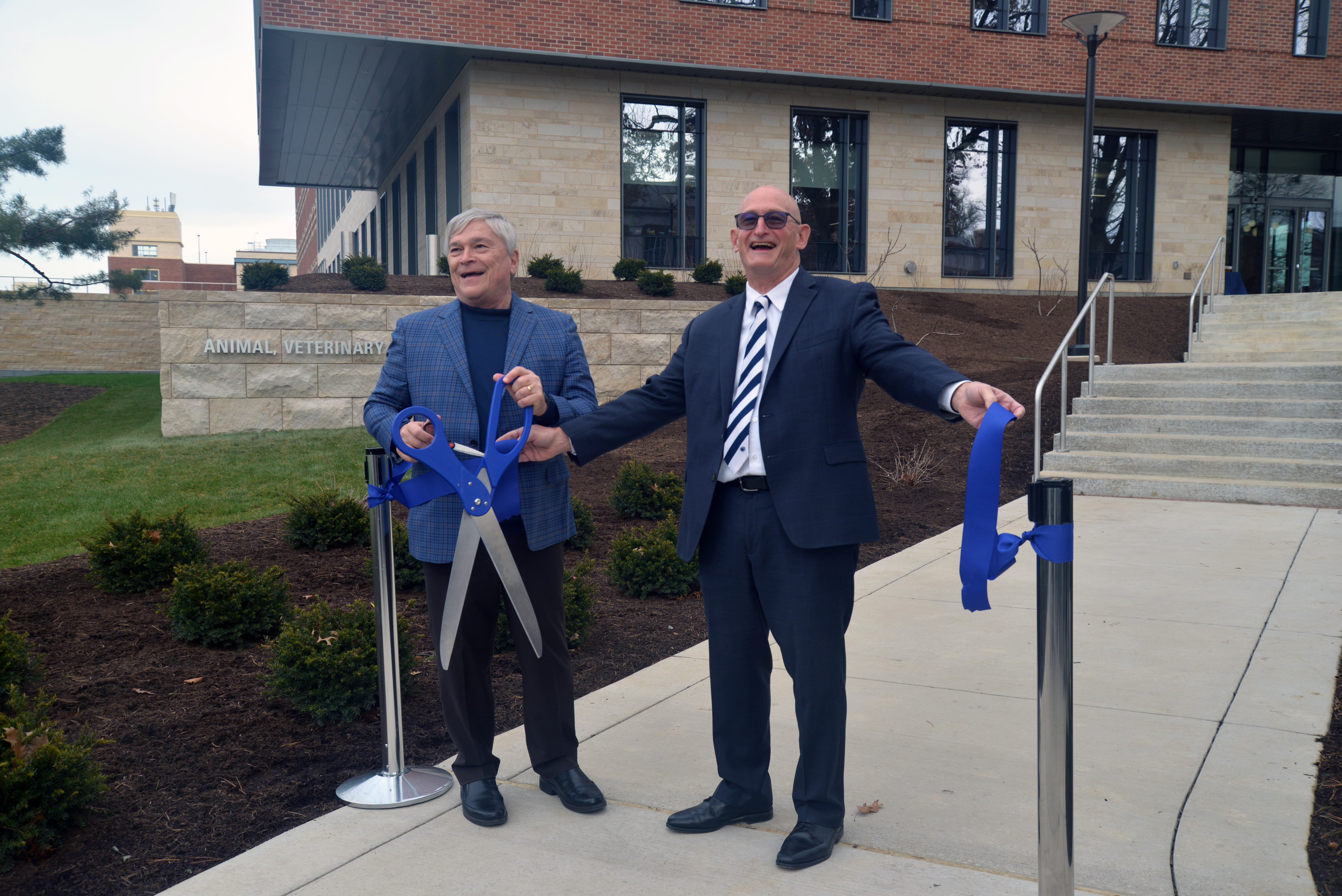 President Barron and Dean Roush unveil the new building