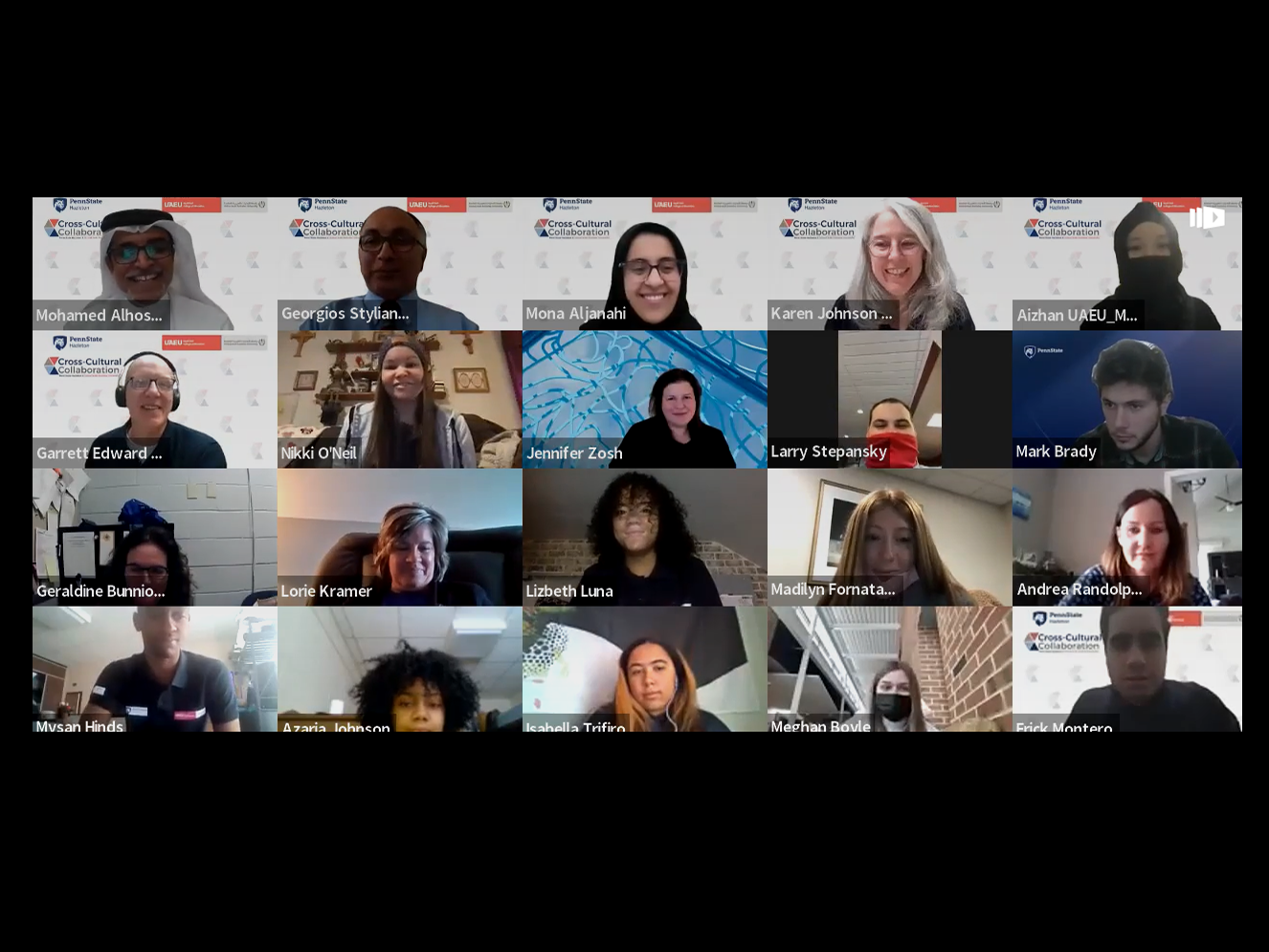 Group of students and university officials smiling and waving during a Zoom meeting.