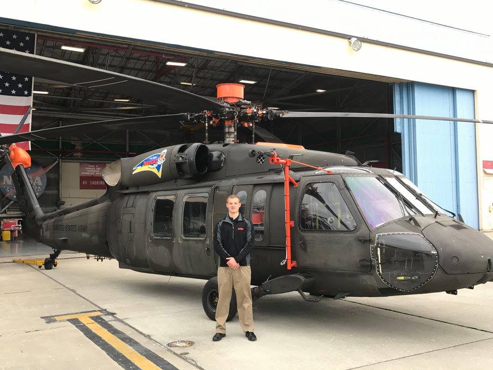 Graduate student Jason Cornelius stands by a Black Hawk helicopter