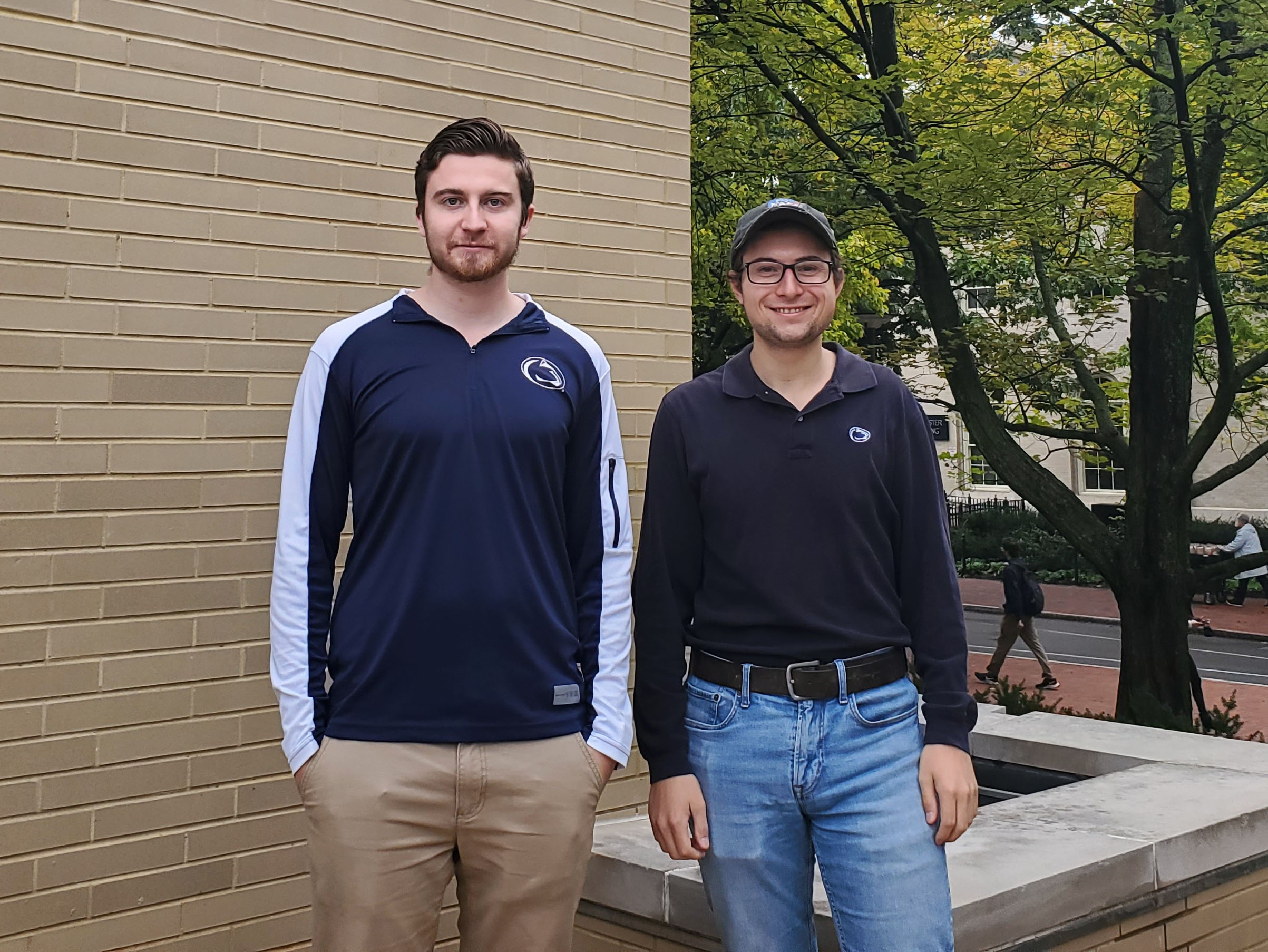 Two men in front of a building 