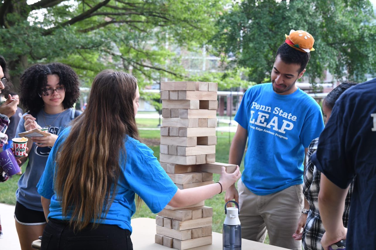 Students playing Jenga game at LEAP