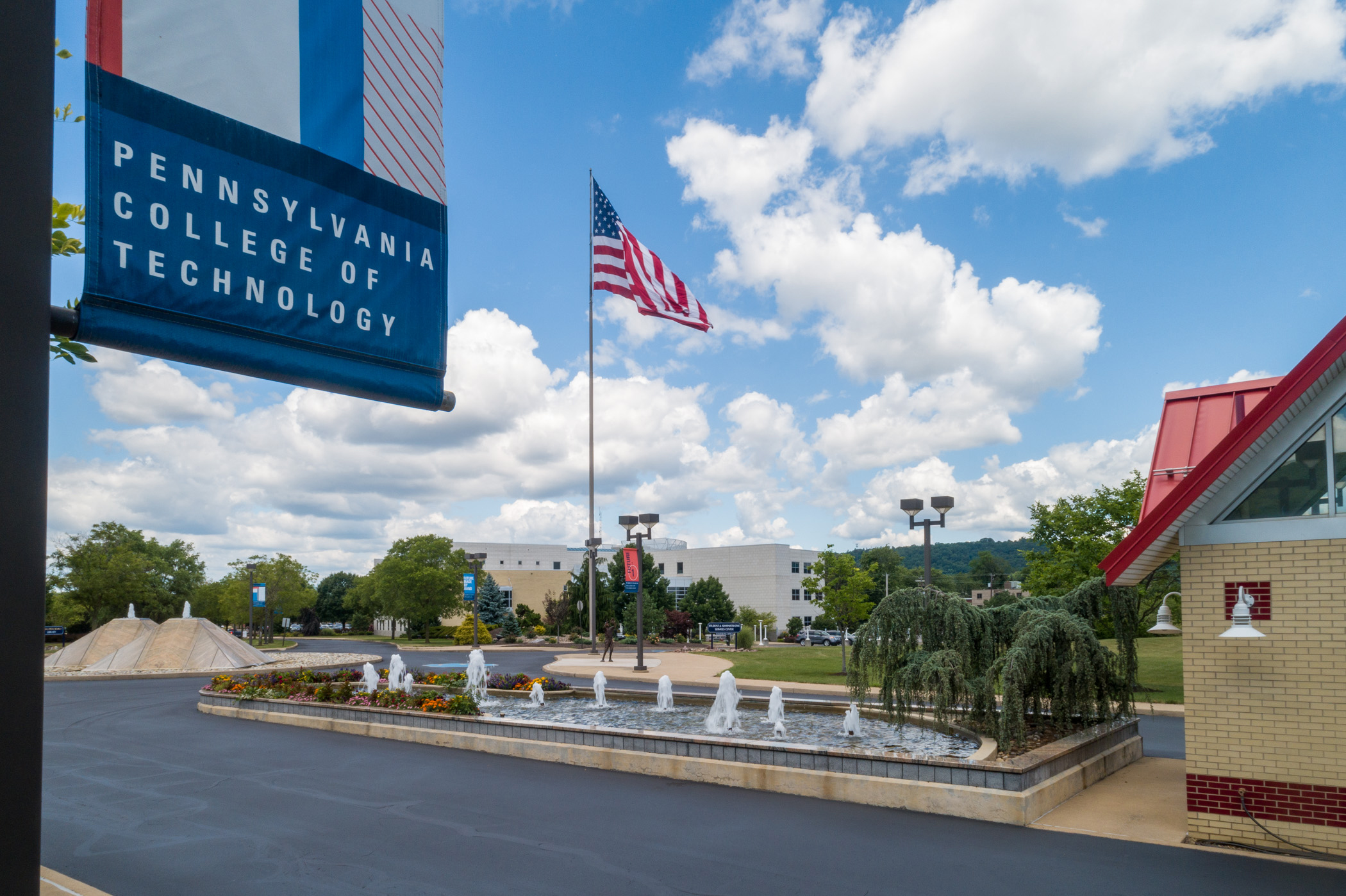 The Penn College campus on a clear day with blue skies and white clouds