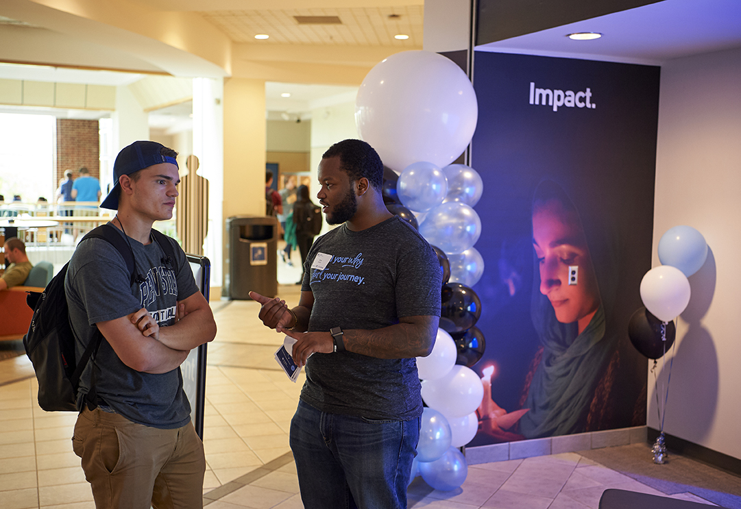 Two students talking at the Engagement Space