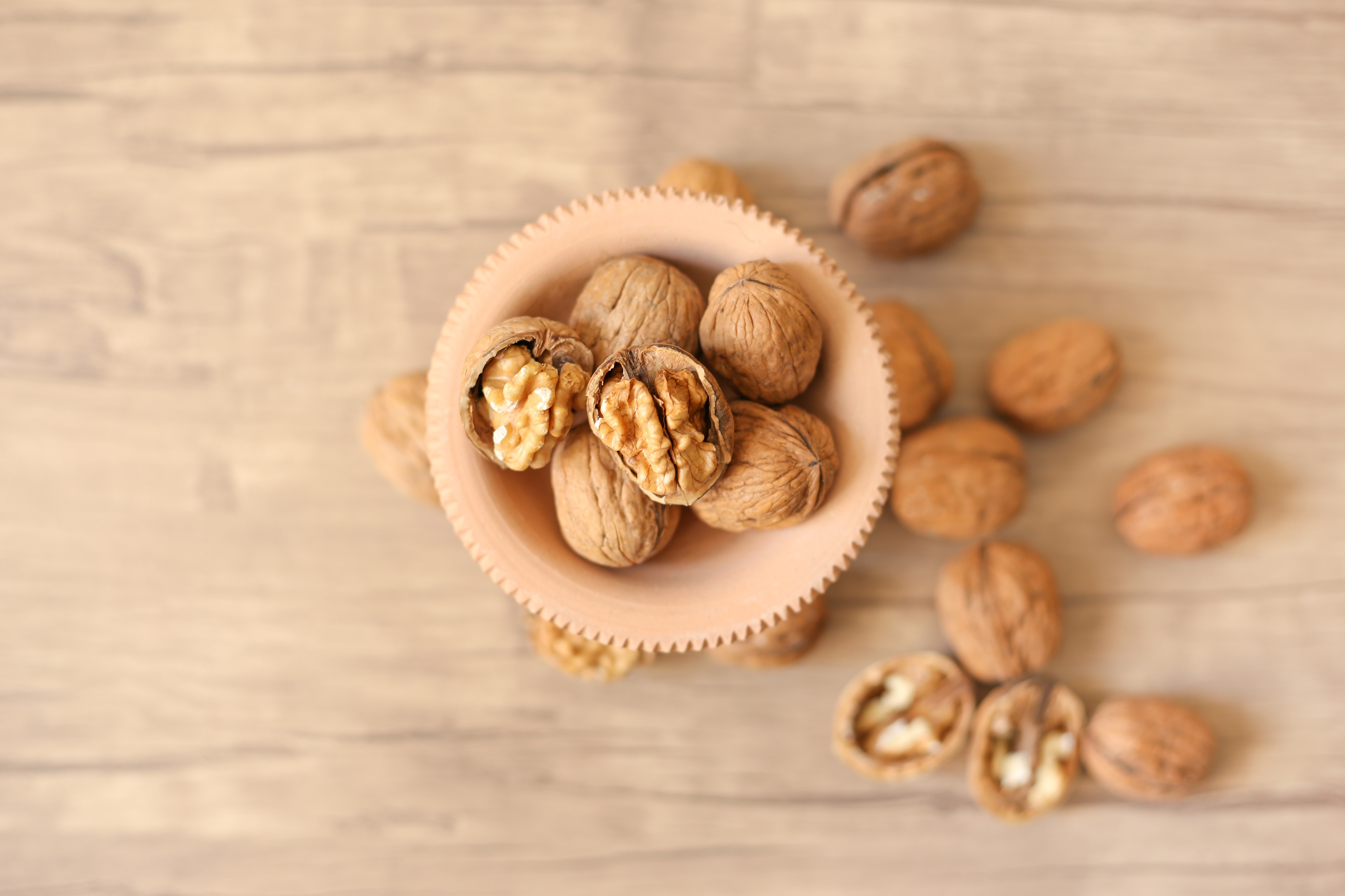 Photo of a bowl of walnuts taken from above