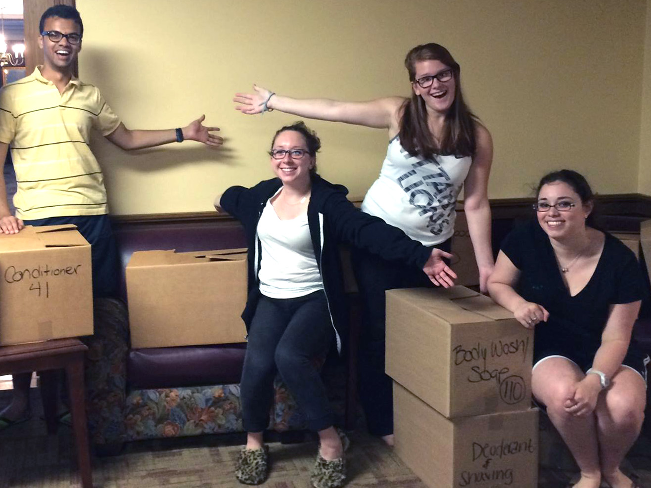 students with boxes of toiletries