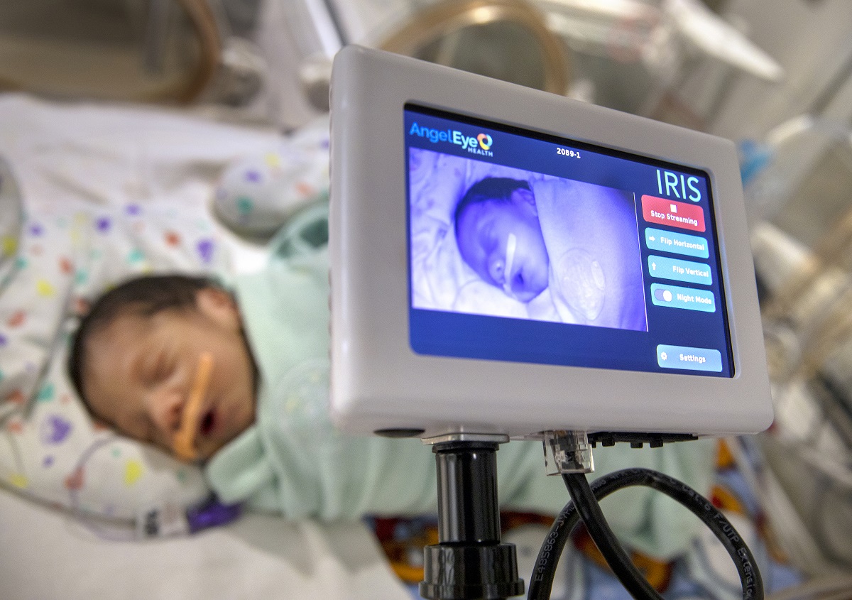 A baby is shown on the monitor of an electronic device.