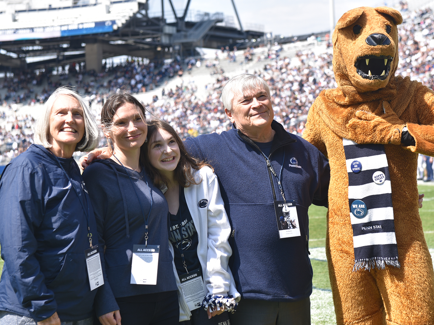 The Barron family is joined on the field by the Nittany Lion during Penn State's 2022 Blue-White Game.