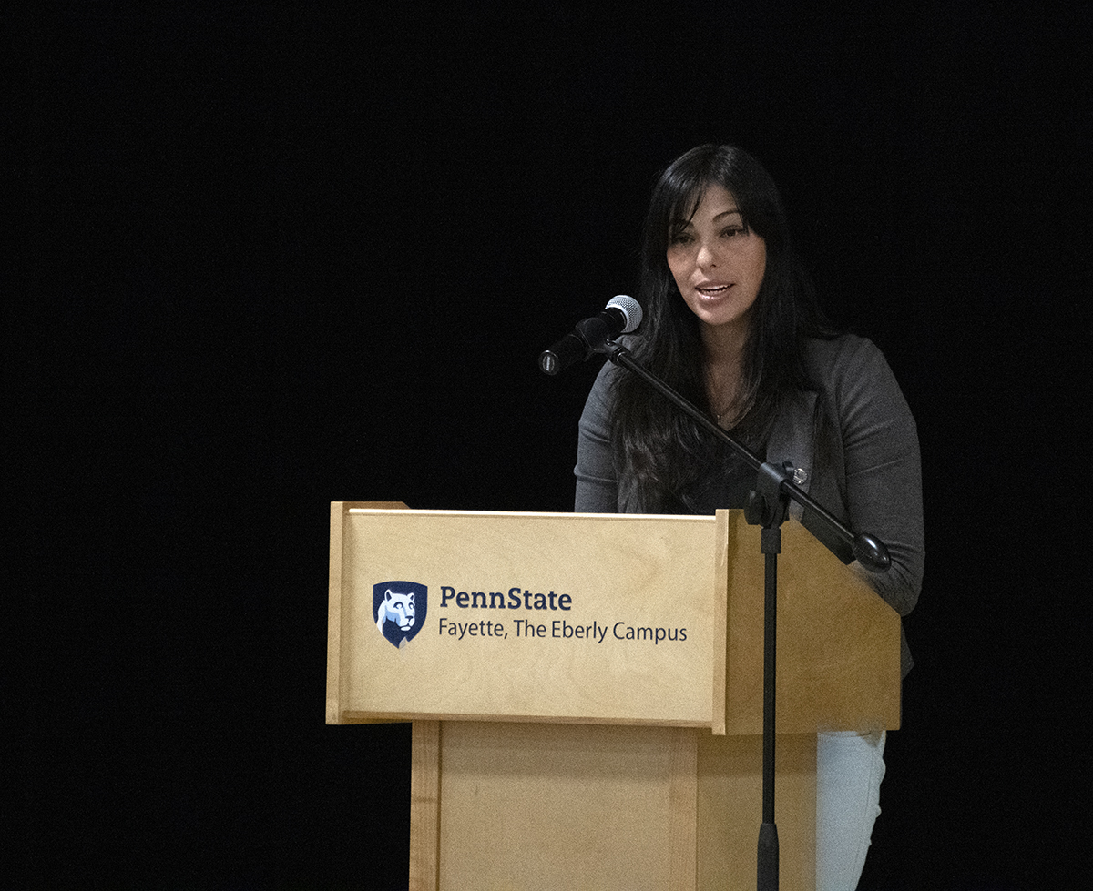 Ginett Pineda inducts forty students into Pi Sigma Phi