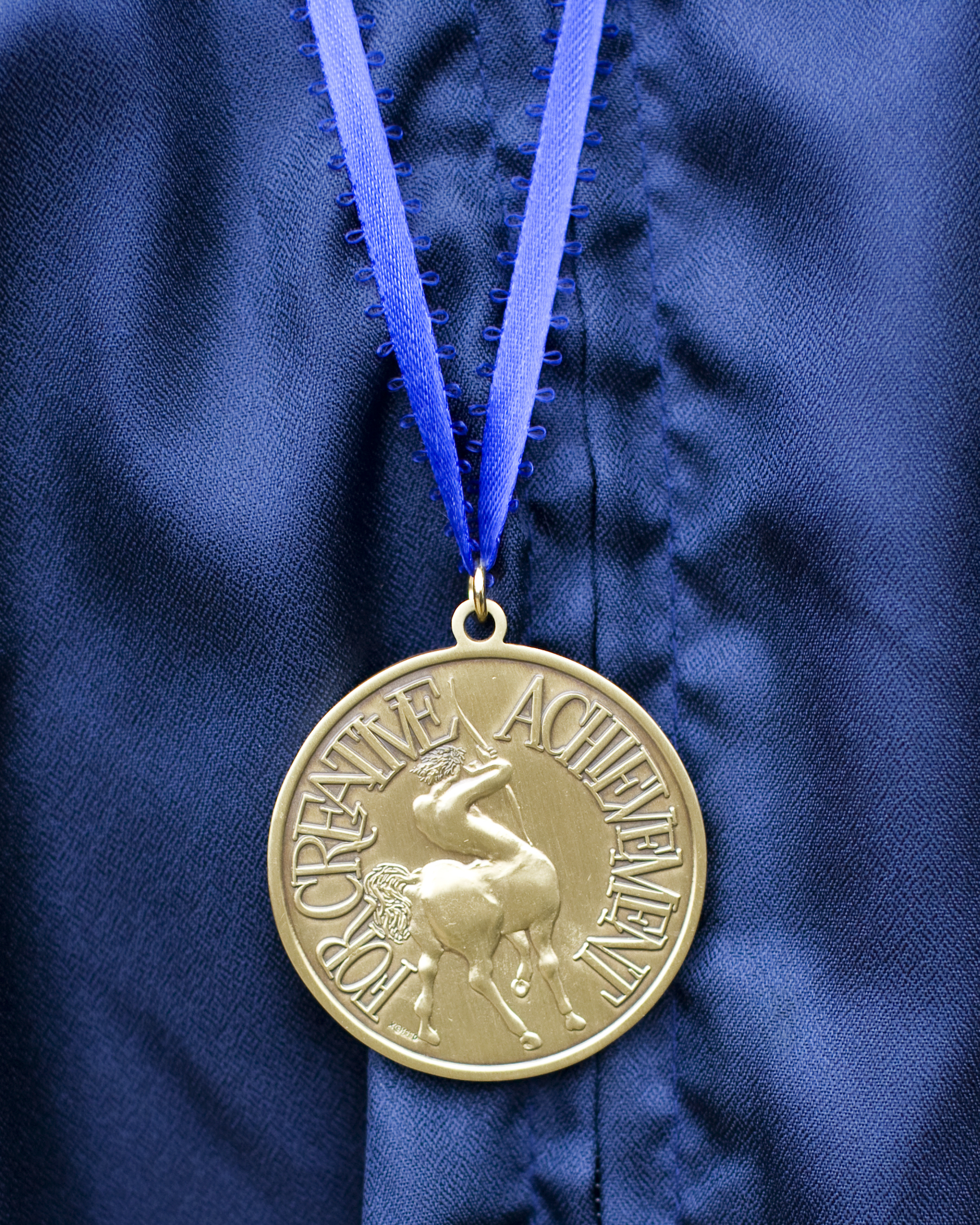 Gold medal on blue background