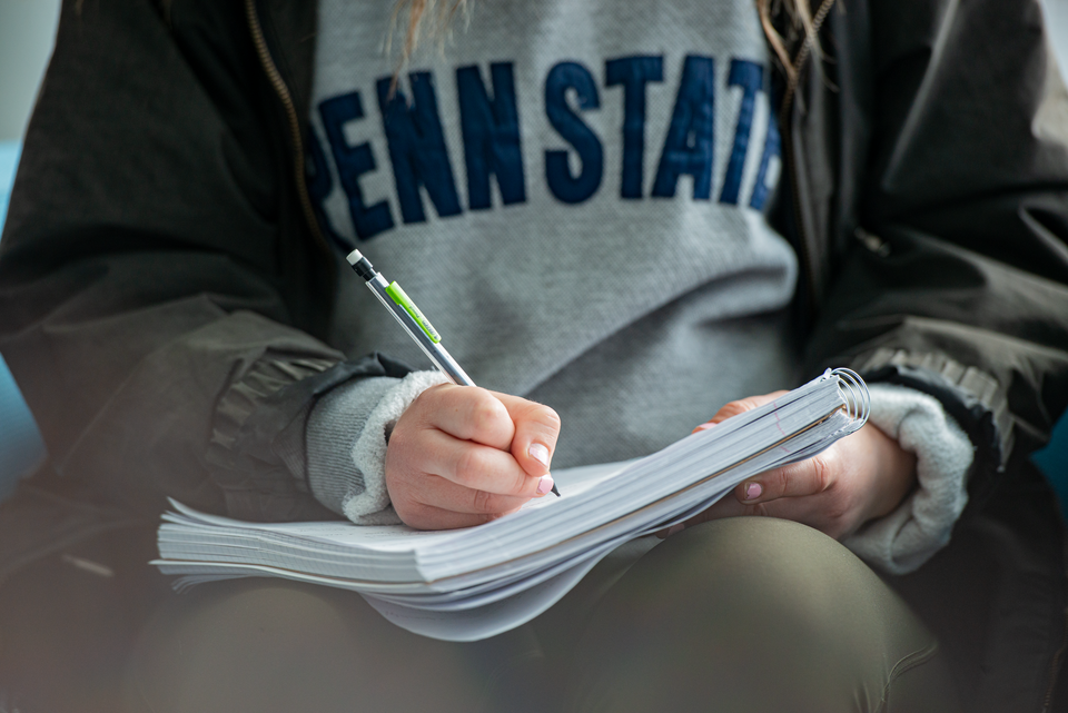 Student taking notes