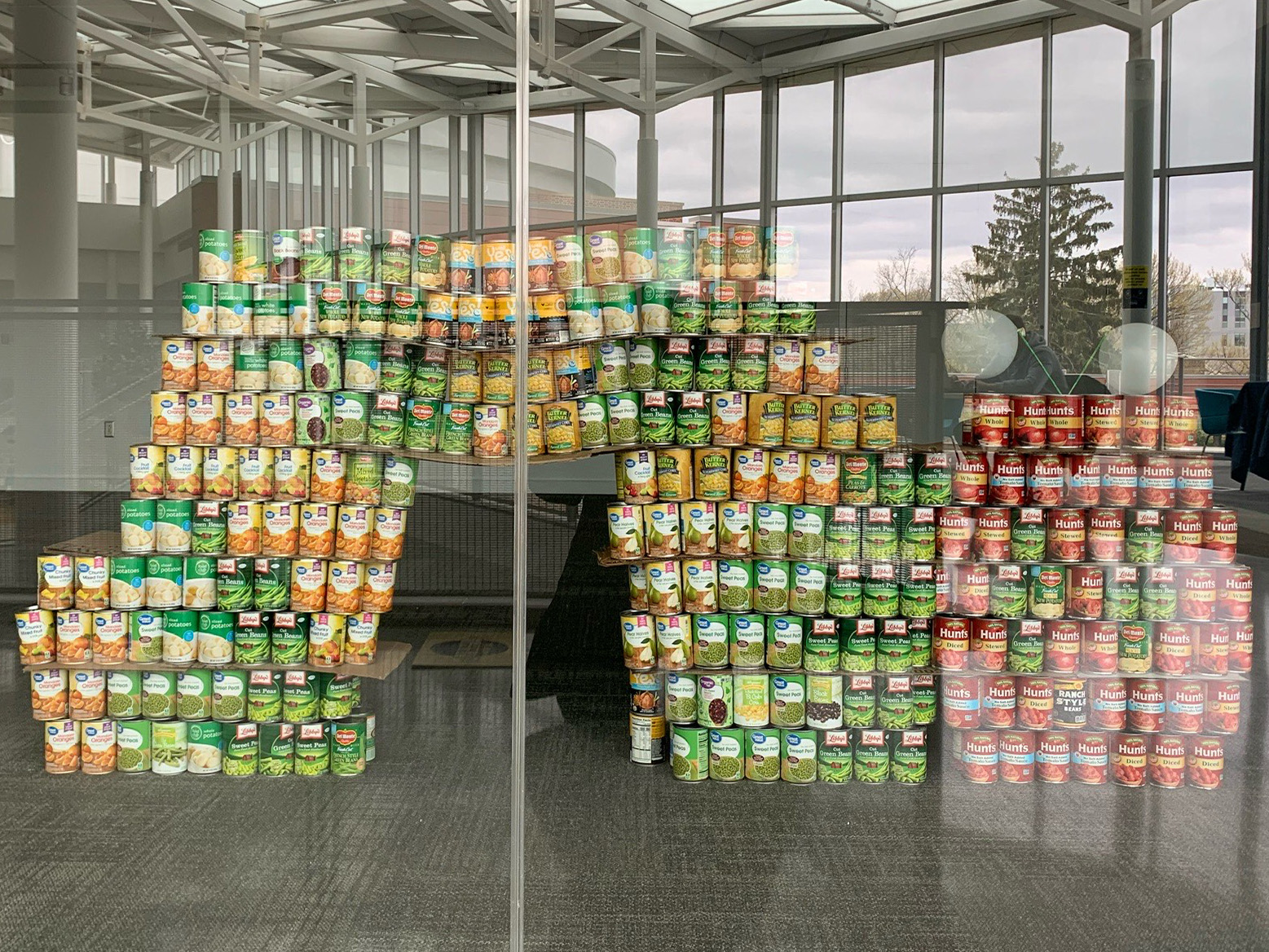 Cans of food in a caterpillar sculpture