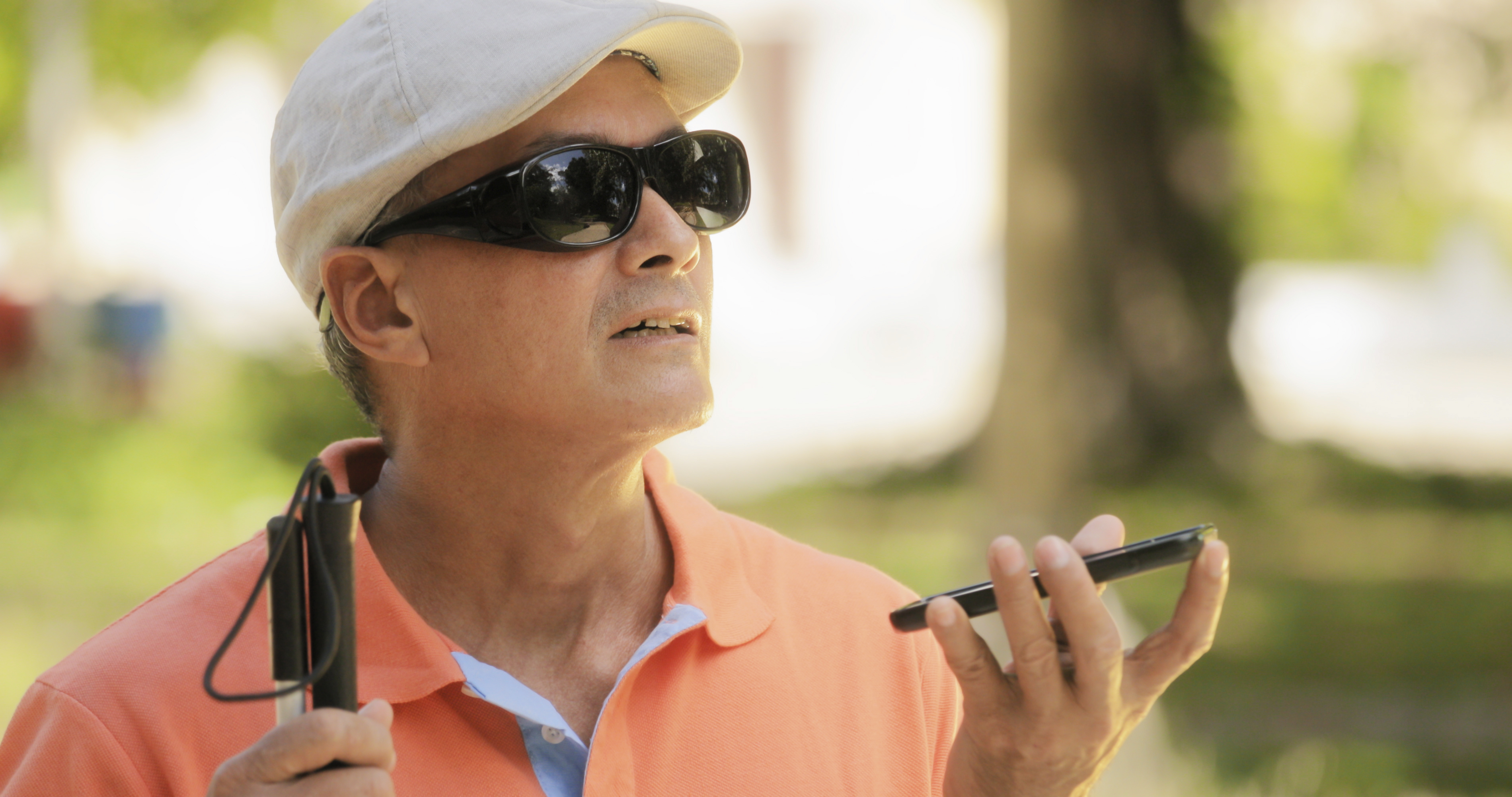 A visually-impaired man uses remote sighted assistance technology.