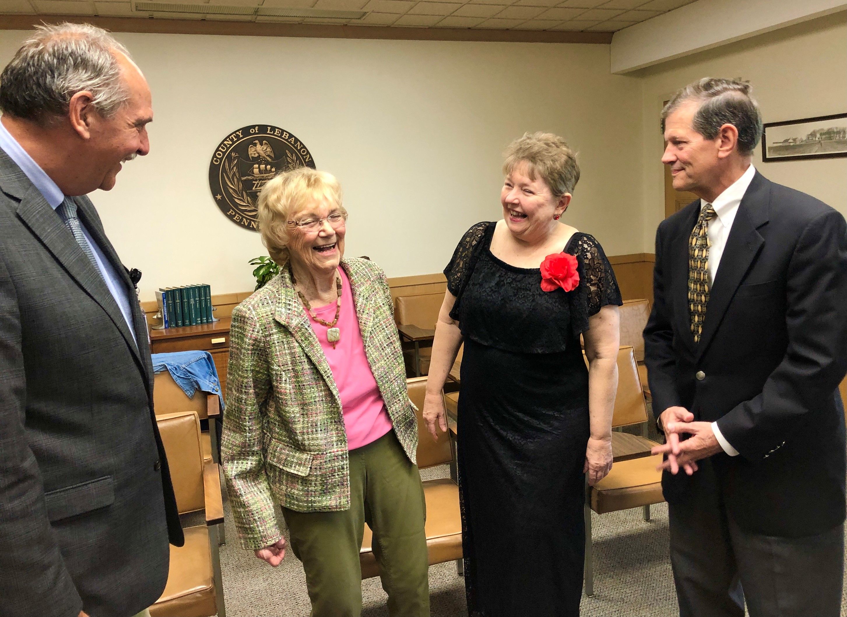 Retired extension educator Alletta Schadler shares a laugh with Lebanon County Commissioners