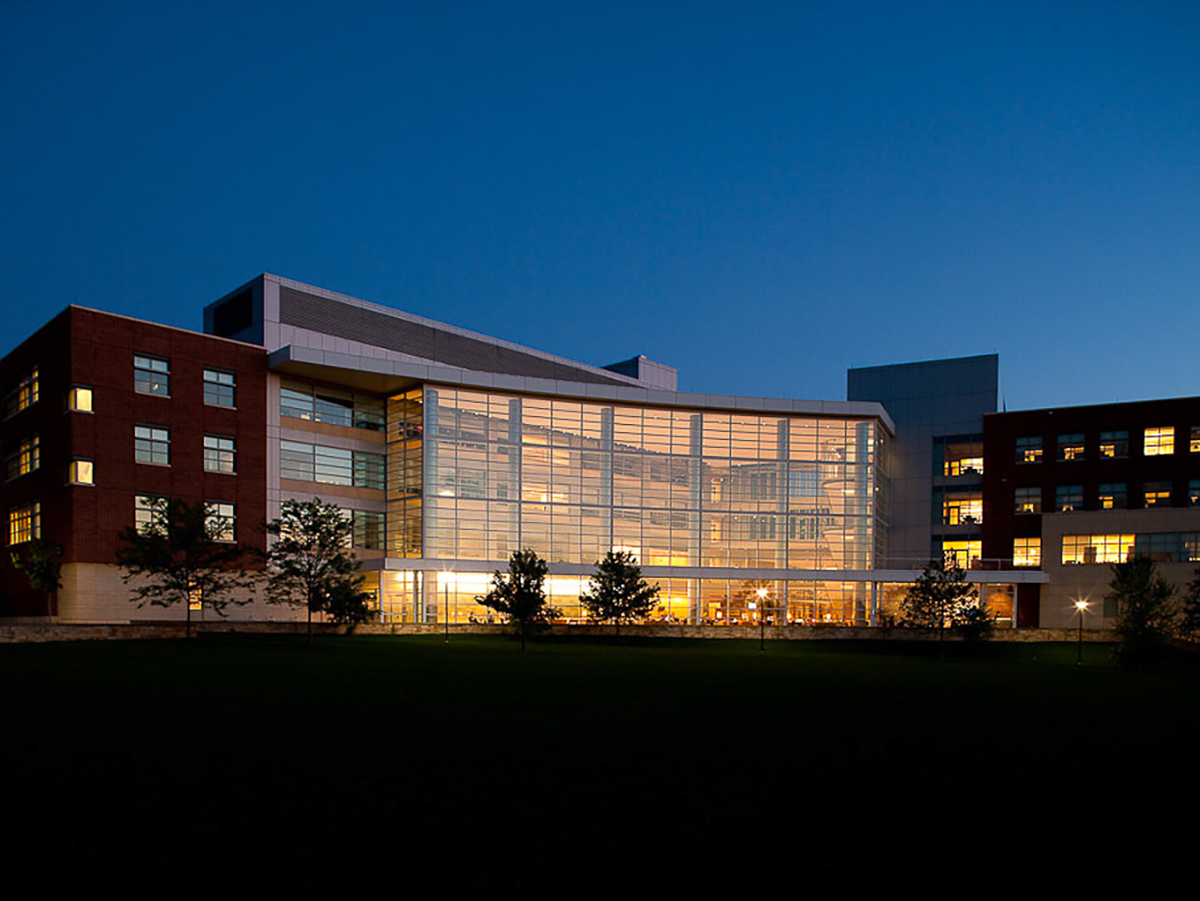 A photo of the Penn State Business Building at night.