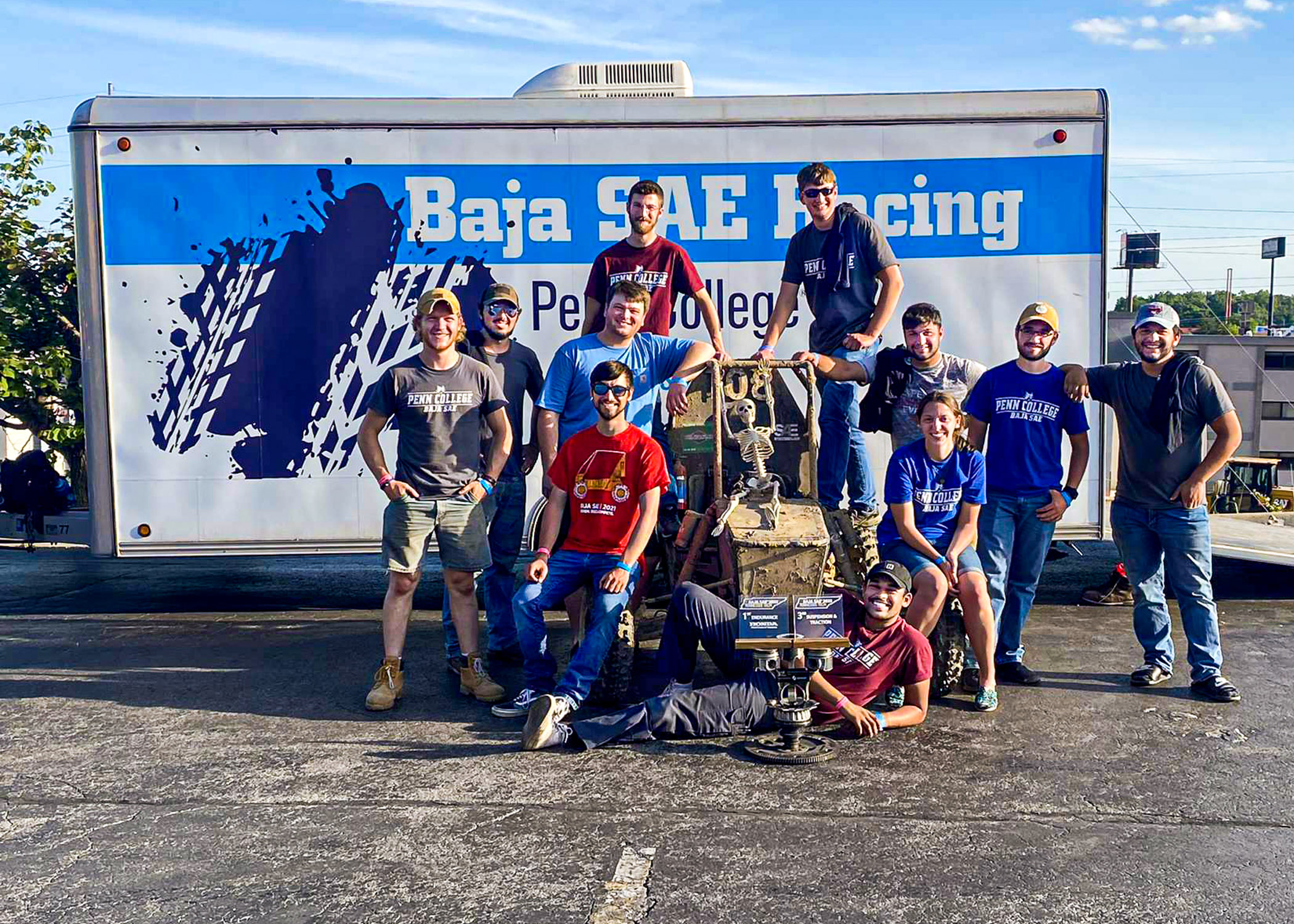 team of students with a first-place trophy