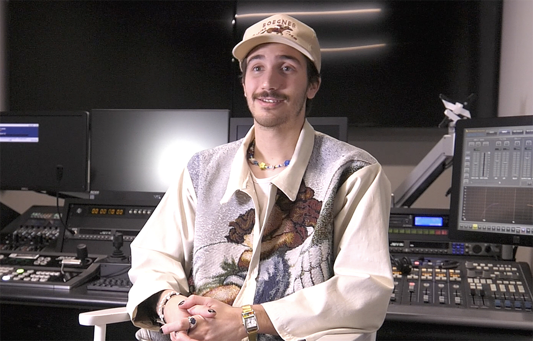 Noah Riffe seated in a TV studio