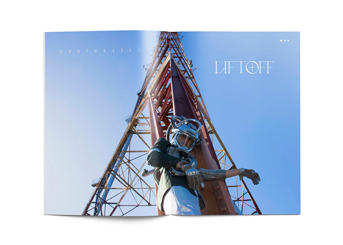 A magazine spread of a man in space suit on a launch pad with the word liftoff in white.