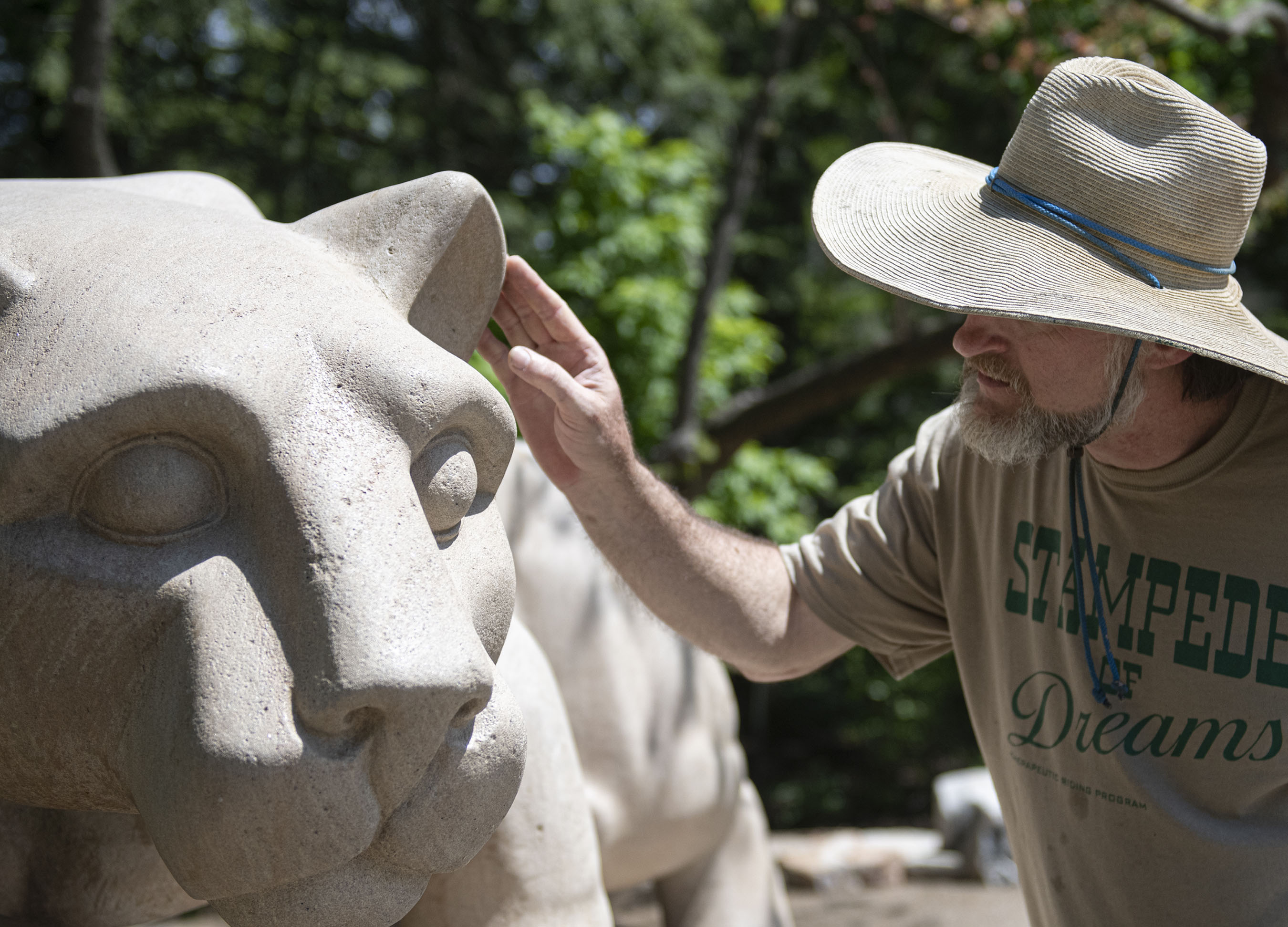 Curtis McCartney checking repairs on LIon Shrine ear