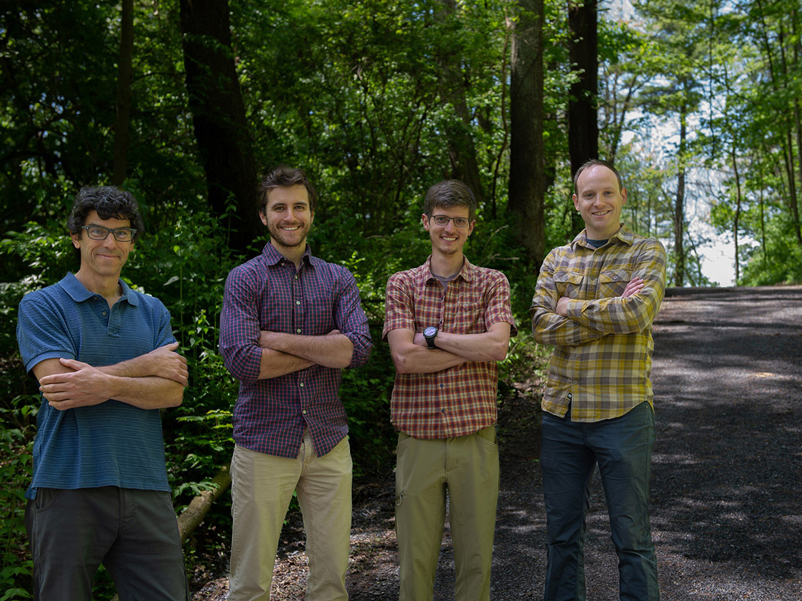 Researchers pose for a photo on a Pennsylvania dirt road