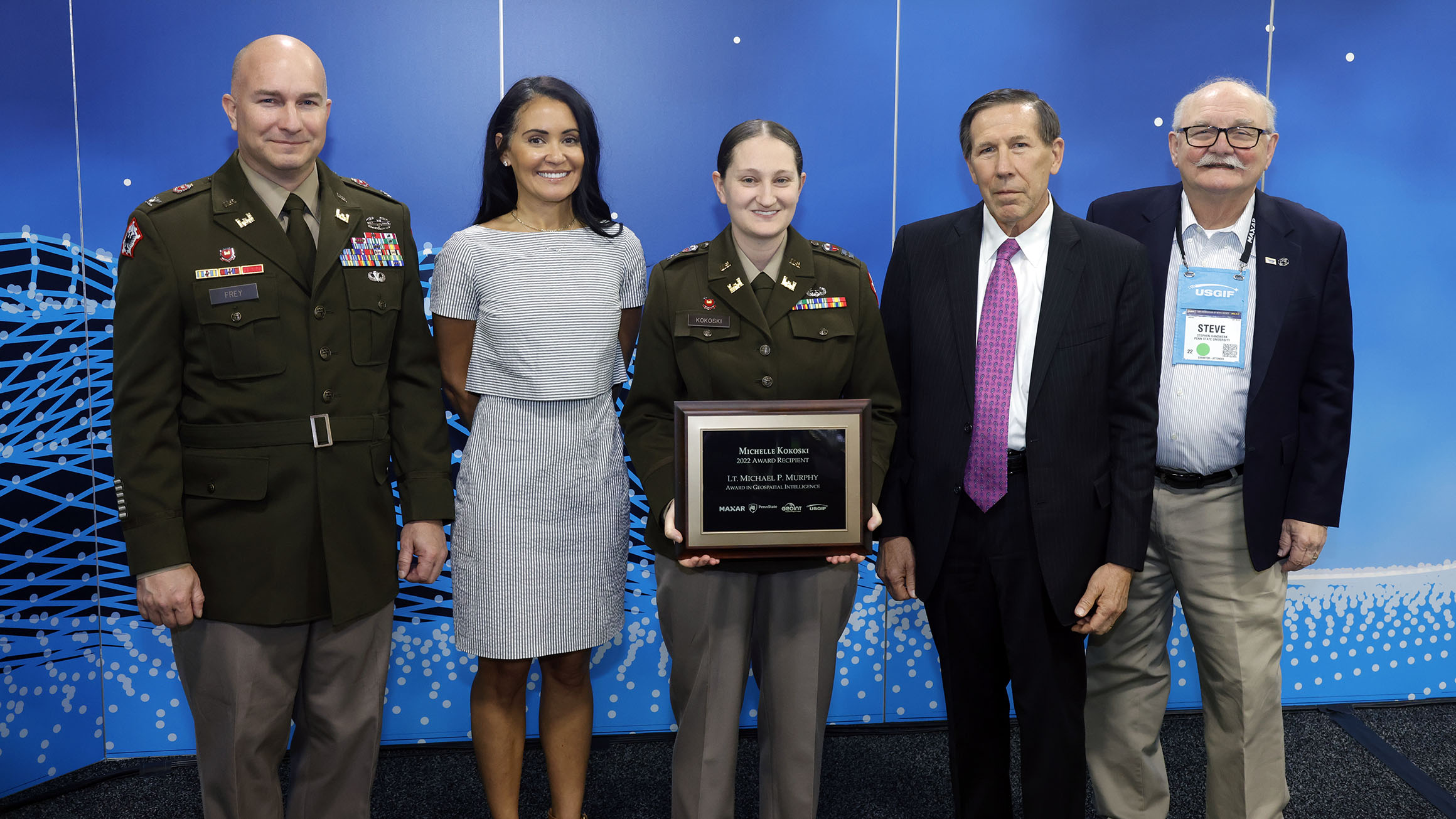 Michelle Kokoski receives the Murphy Award with faculty