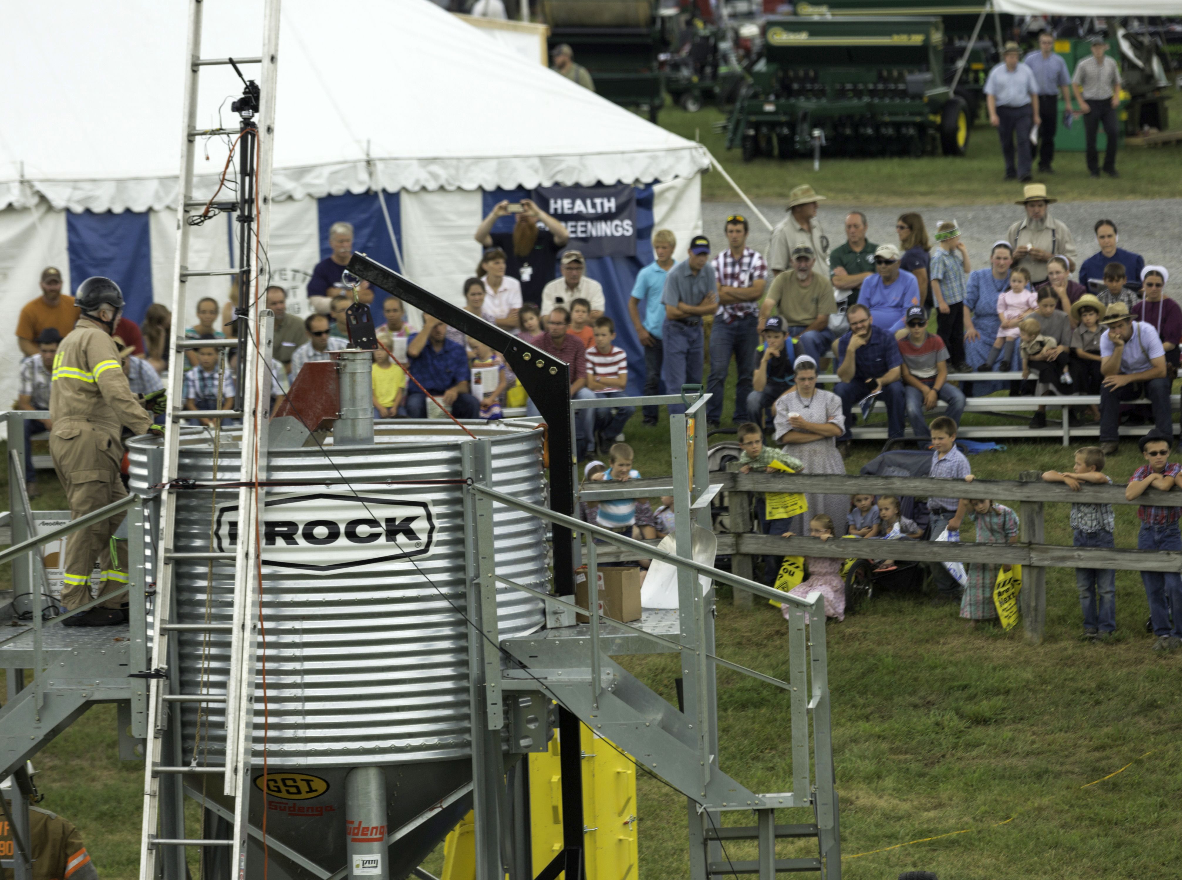 A crowd watches a demonstration of grain bin safety hazards at 2019 Ag Progress Days