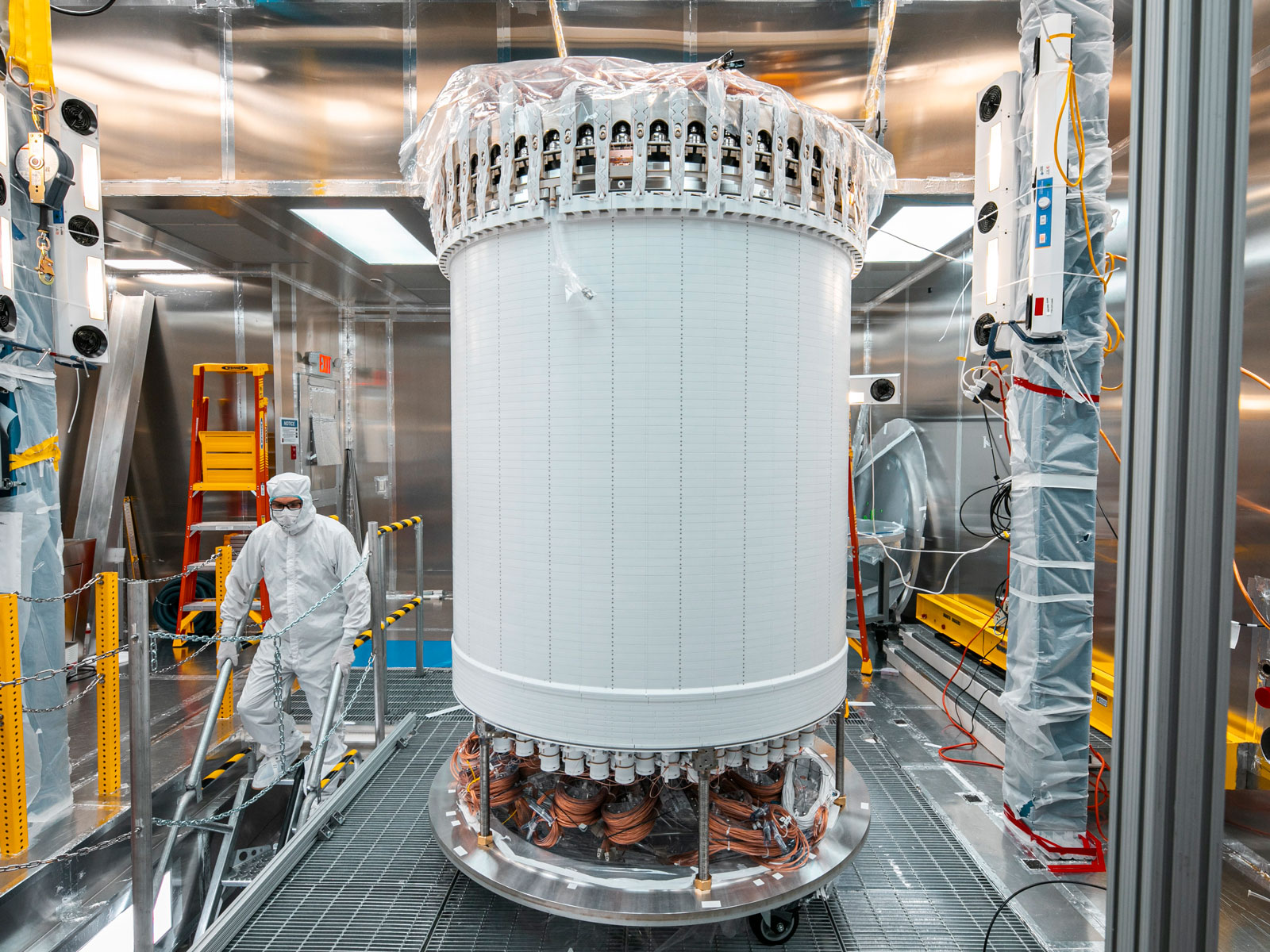 LZ detector in sealed room while person in cleanroom suit walks by