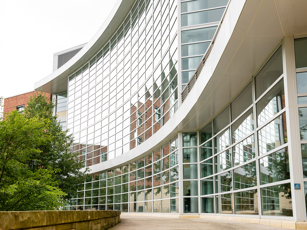 A photo of the Business Building, highlighting the front curve and its windowed exterior.