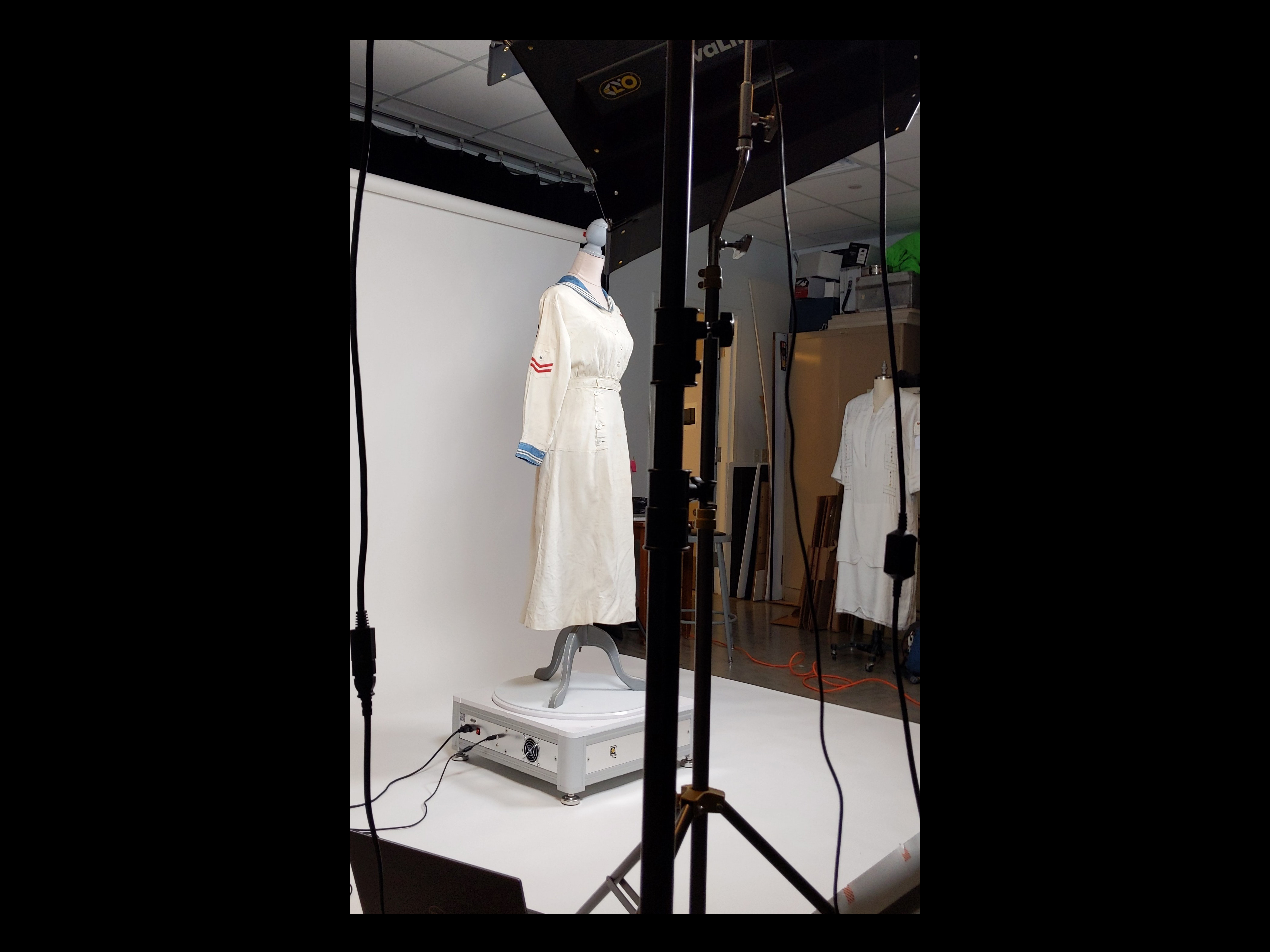 Linen nurse uniform from early 20th century on turntable for 360-degree photography