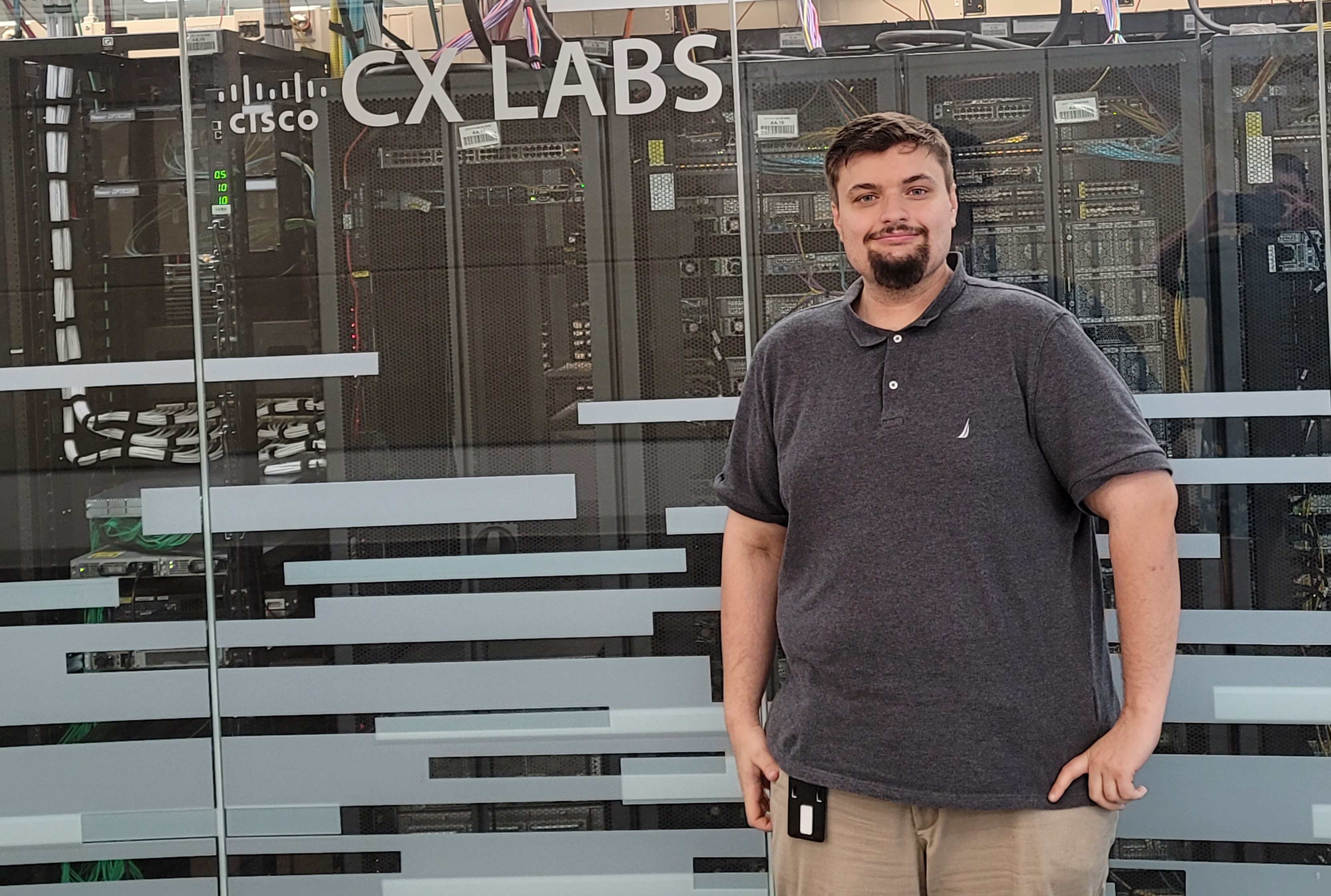 James Reese stands in front of the CISCO CX Labs