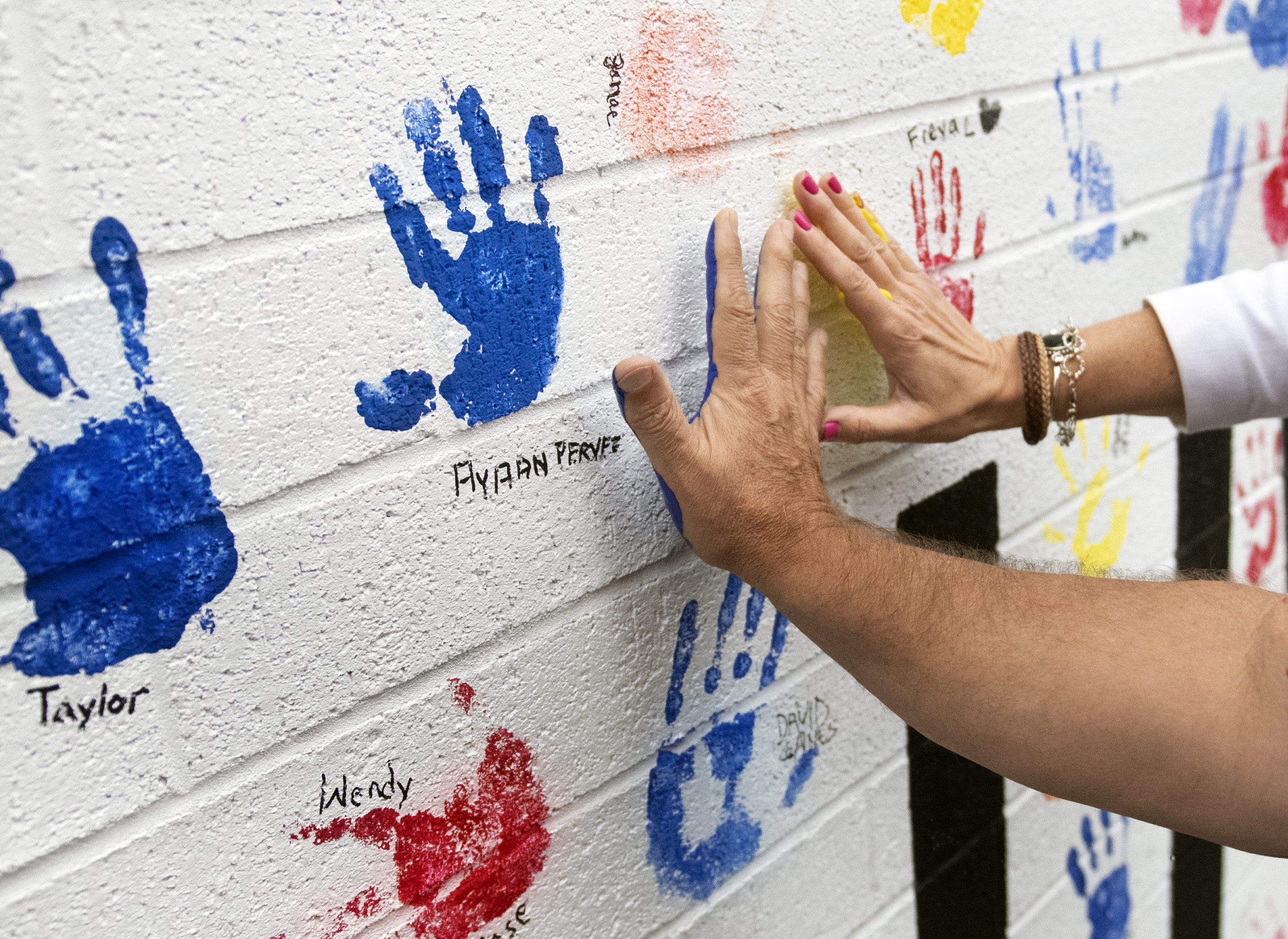 donors add handprints to new all hands on deck mural