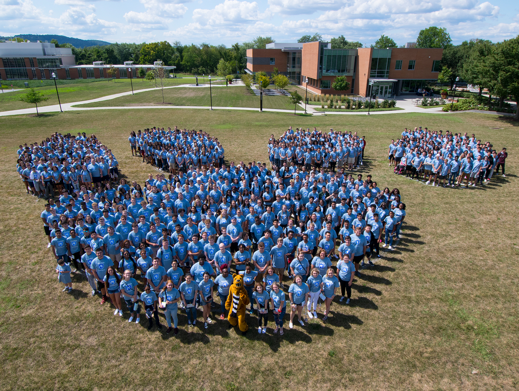 students and nittany lion in shape of paw