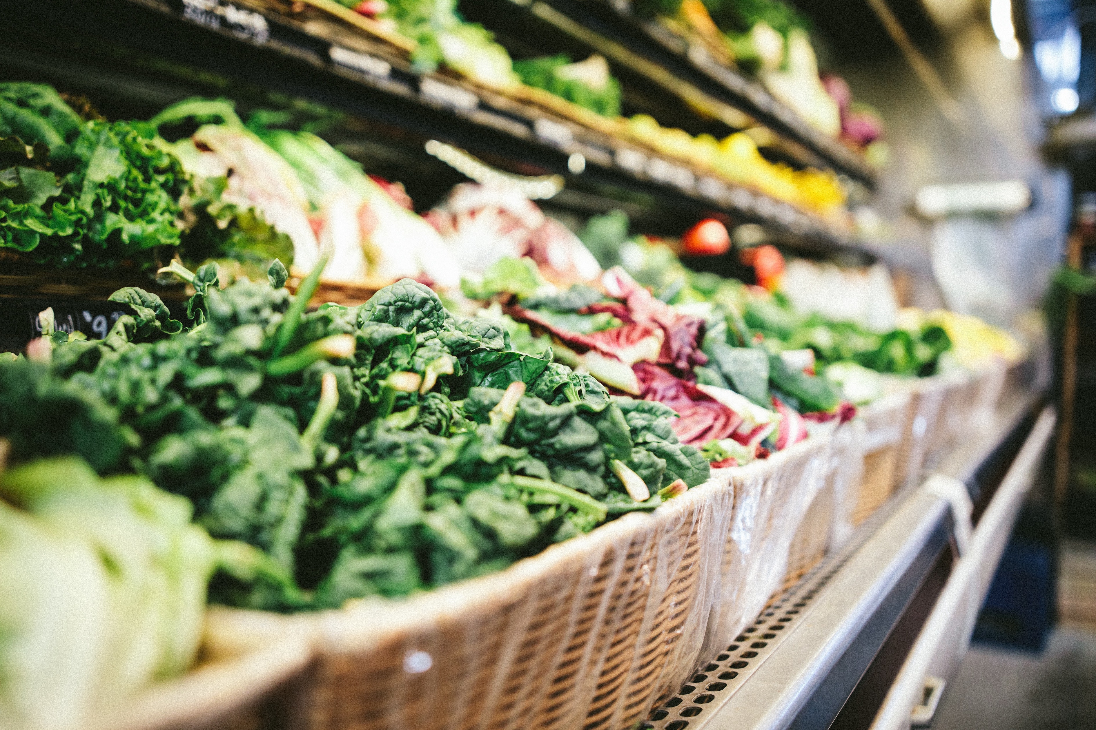 A line of fresh produce in a grocery store display