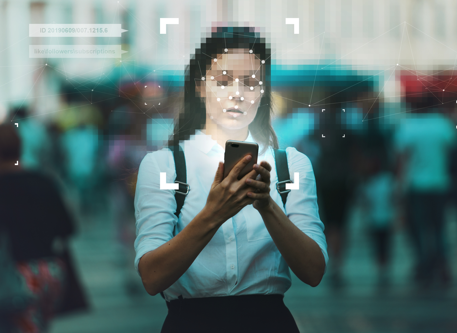 A woman uses facial recognition technology on her mobile phone