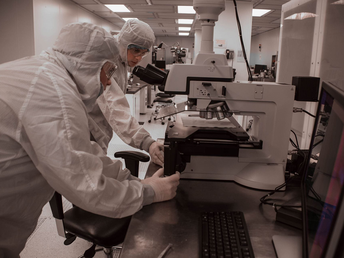 Students in a nano lab looking through microscopes