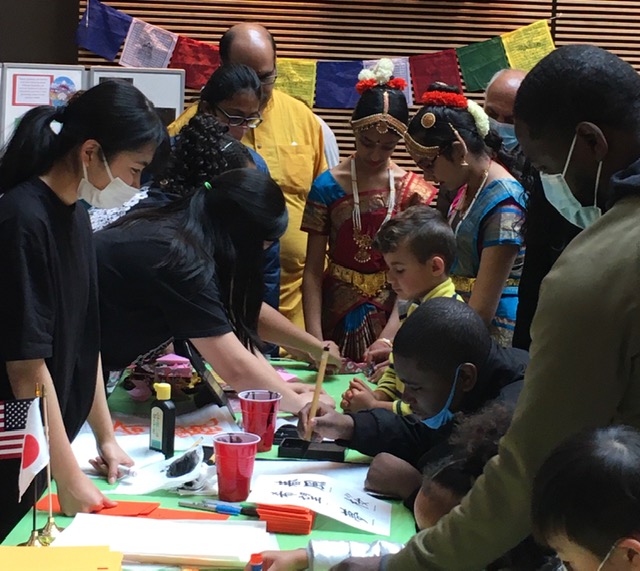 Children learning Chinese characters at a festival