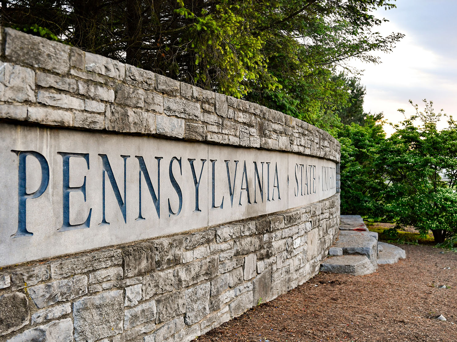 A stone wall reads "Pennsylvania State University"