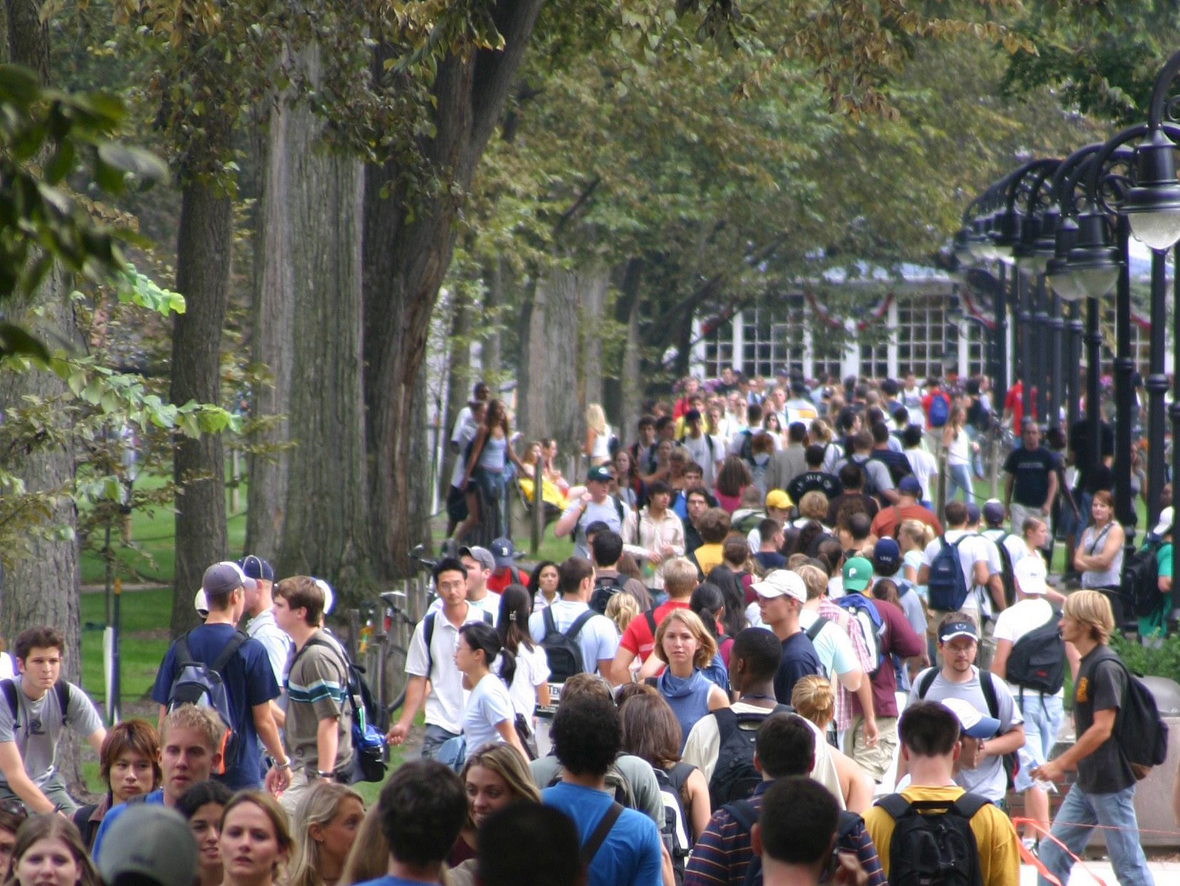 Students on the Allen Street Mall at University Park with downtown State College in the distance.