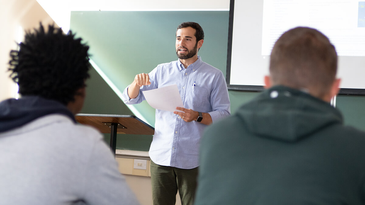 Professor giving a lecture in front of a classroom of students