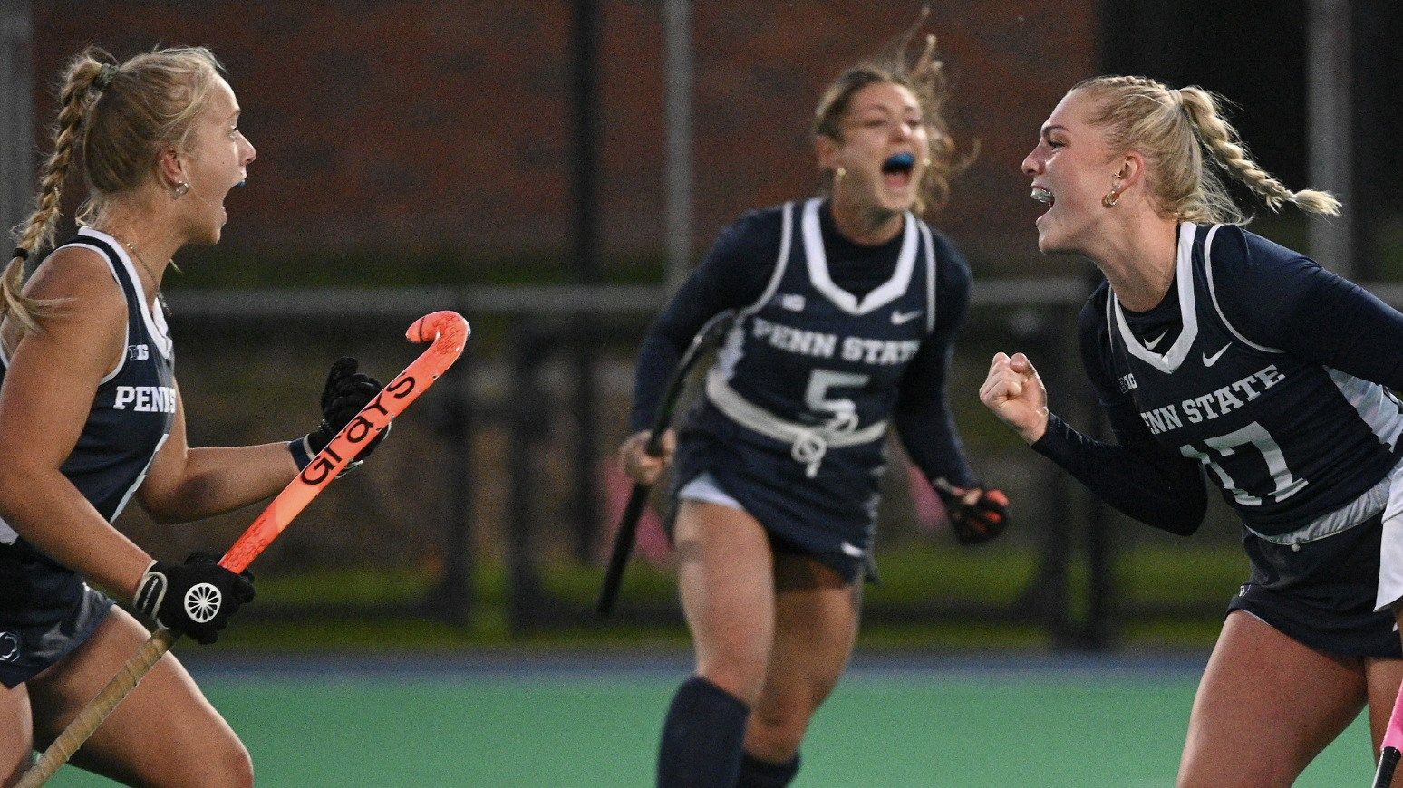 Field hockey players celebrate