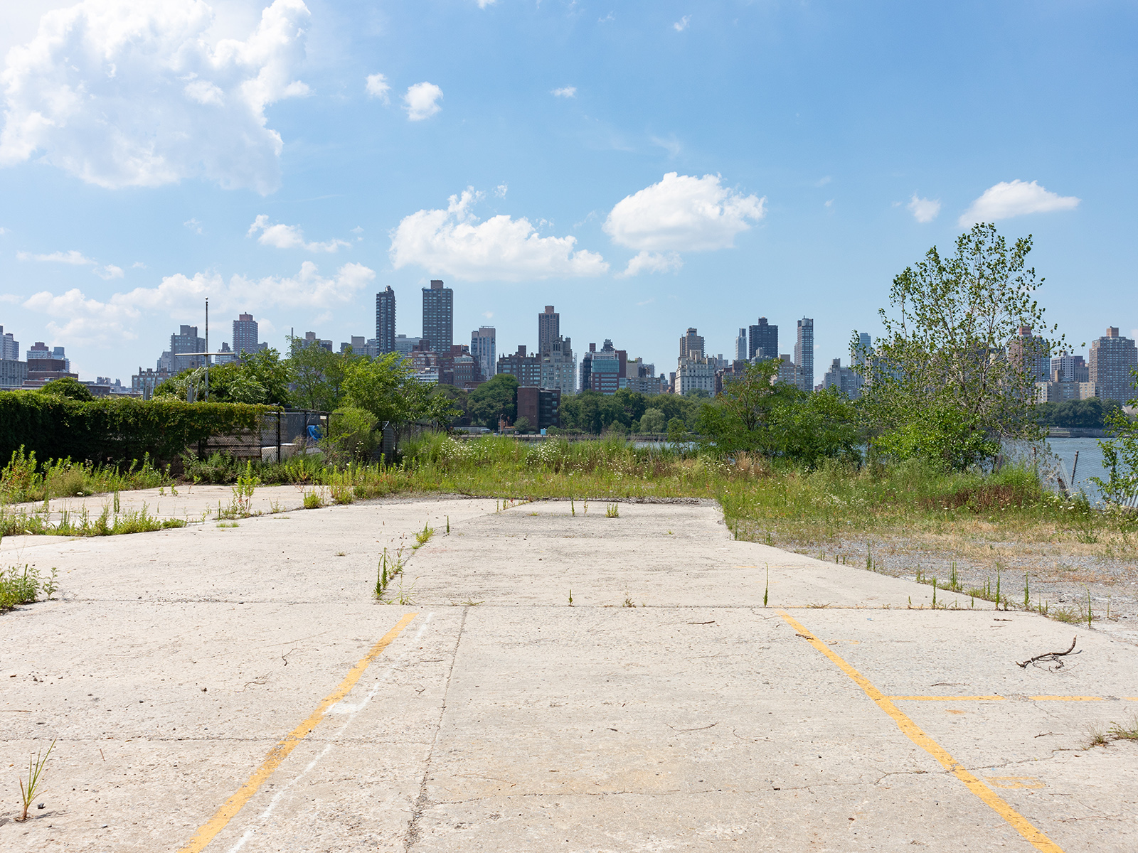 A vacant lot in Queens sits across the East River from Manhattan.