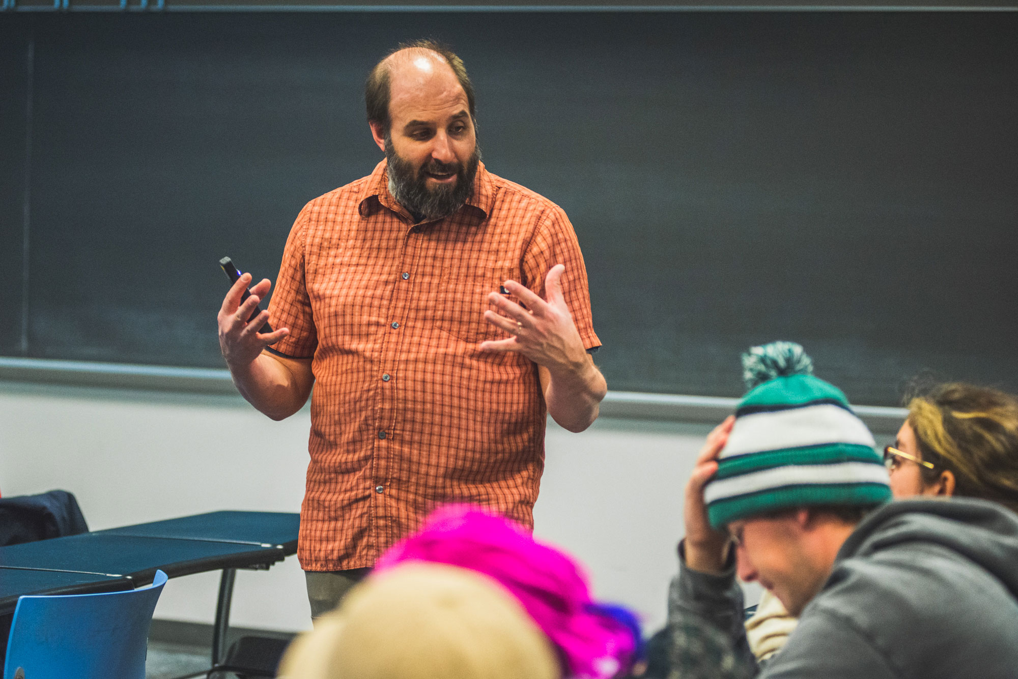 deForest stands in front of students during class 