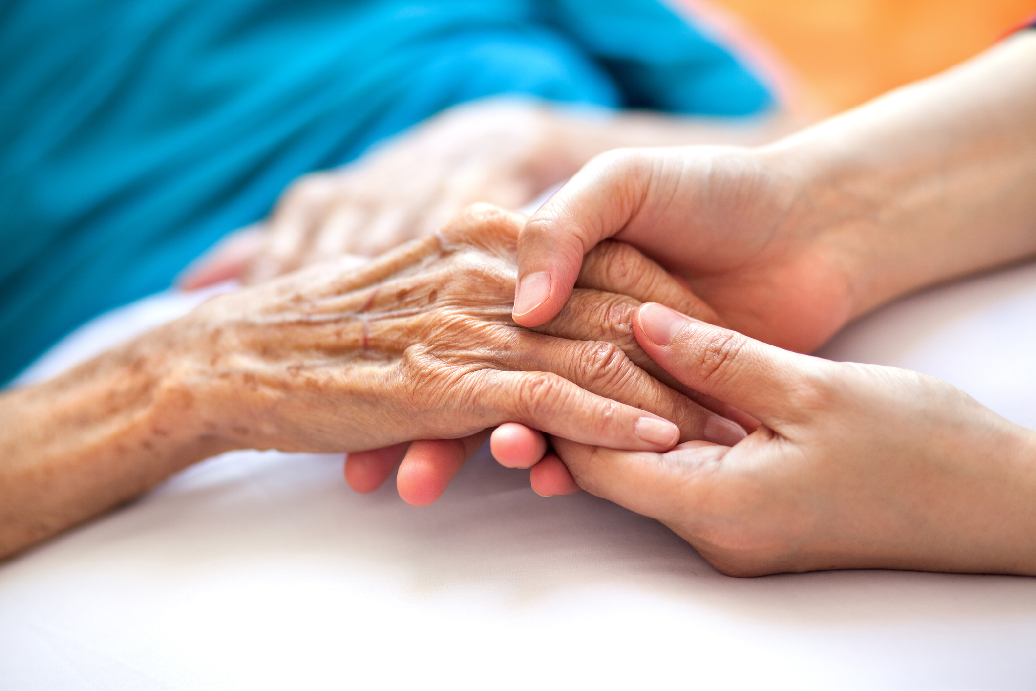 Doctor holding patient's hand